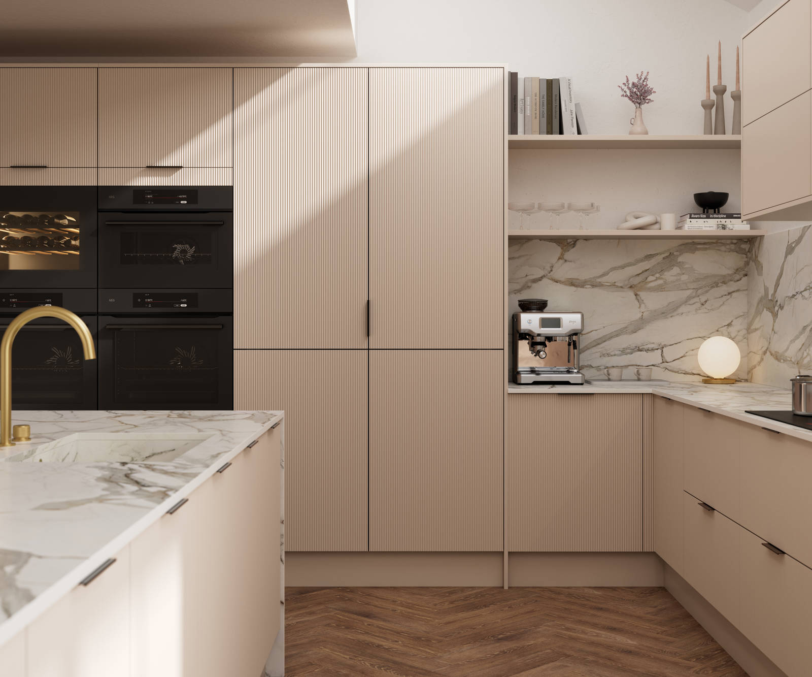 Fluted front kitchen Reed from Magnet in light warm neutral shade Shell, with a marbled splashback and worktop, brass tap in kitchen island sink