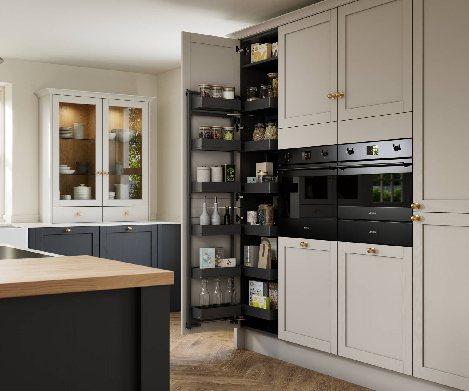 Contemporary Shaker kitchen island Ambleside from Magnet in deep blue shade Lake with beige tall cabinets, herringbone wood flooring and wood diningroom table