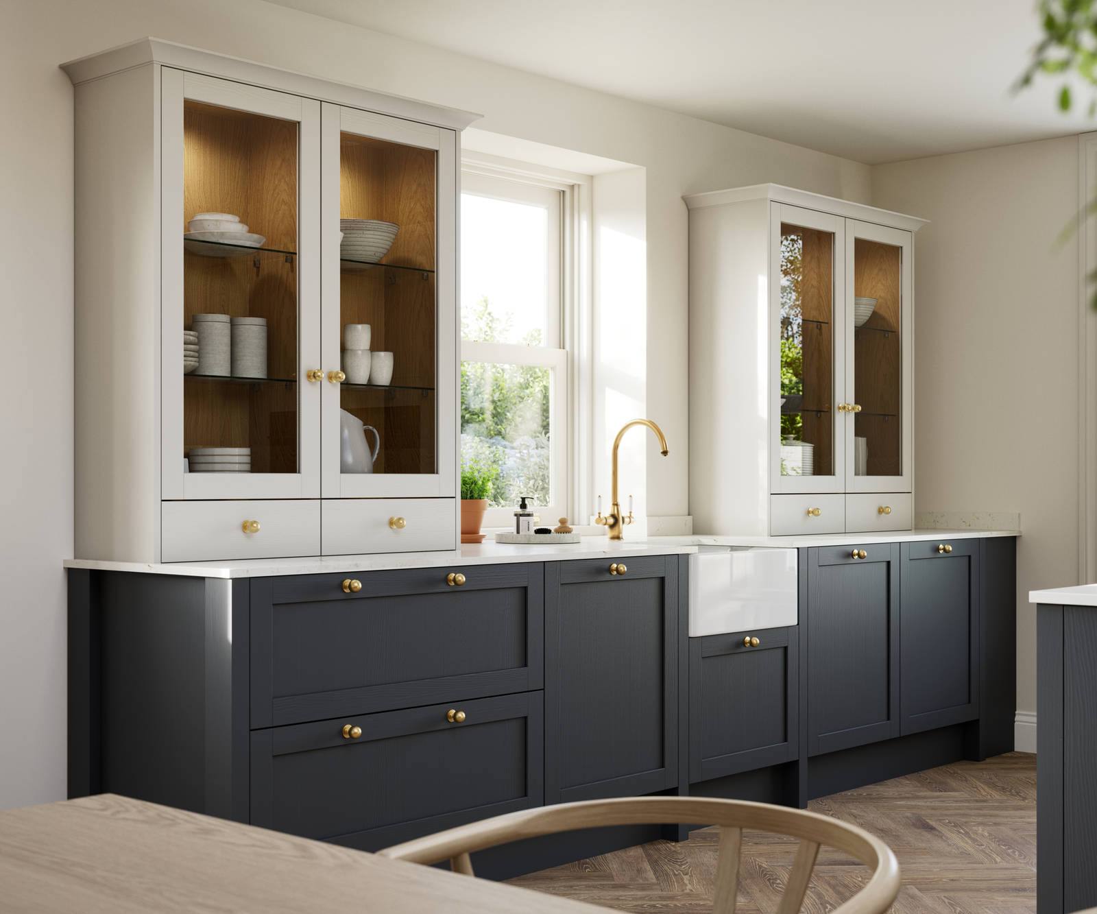 Contemporary Shaker kitchen Ambleside from Magnet in deep blue shade Lake with beige glass fronted dresser cabinets, belfast ceramic sink and brass knobs matching brass tap