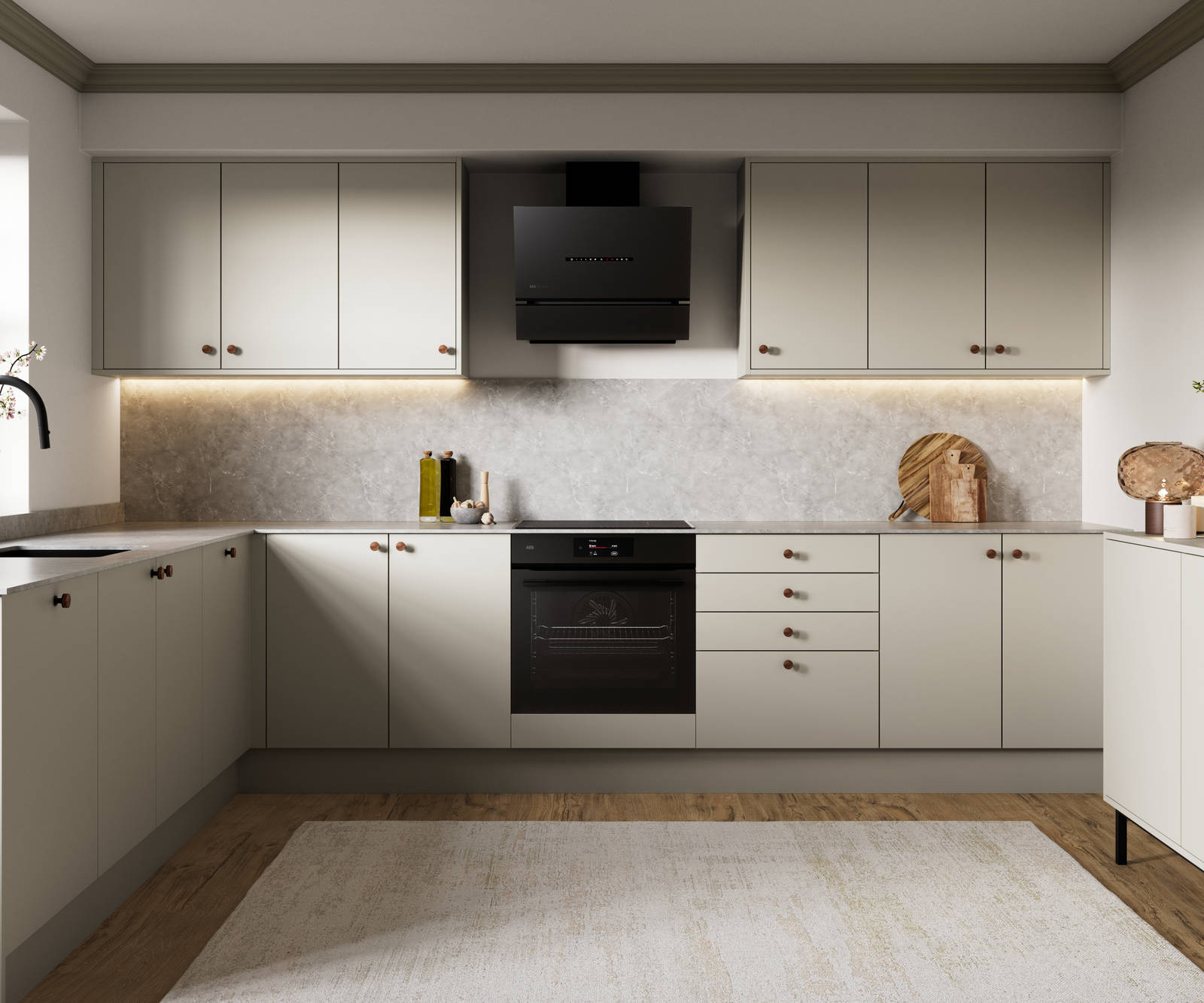 Modern slab kitchen Ascoli in neutral shade Limestone with brass knobs and black tap