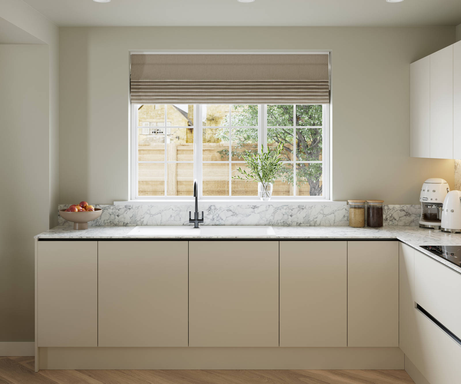 Open plan light neutral shade fluted kitchen with integrated appliances, white and grey marble worktop and upstand. Herringbone wood flooring.