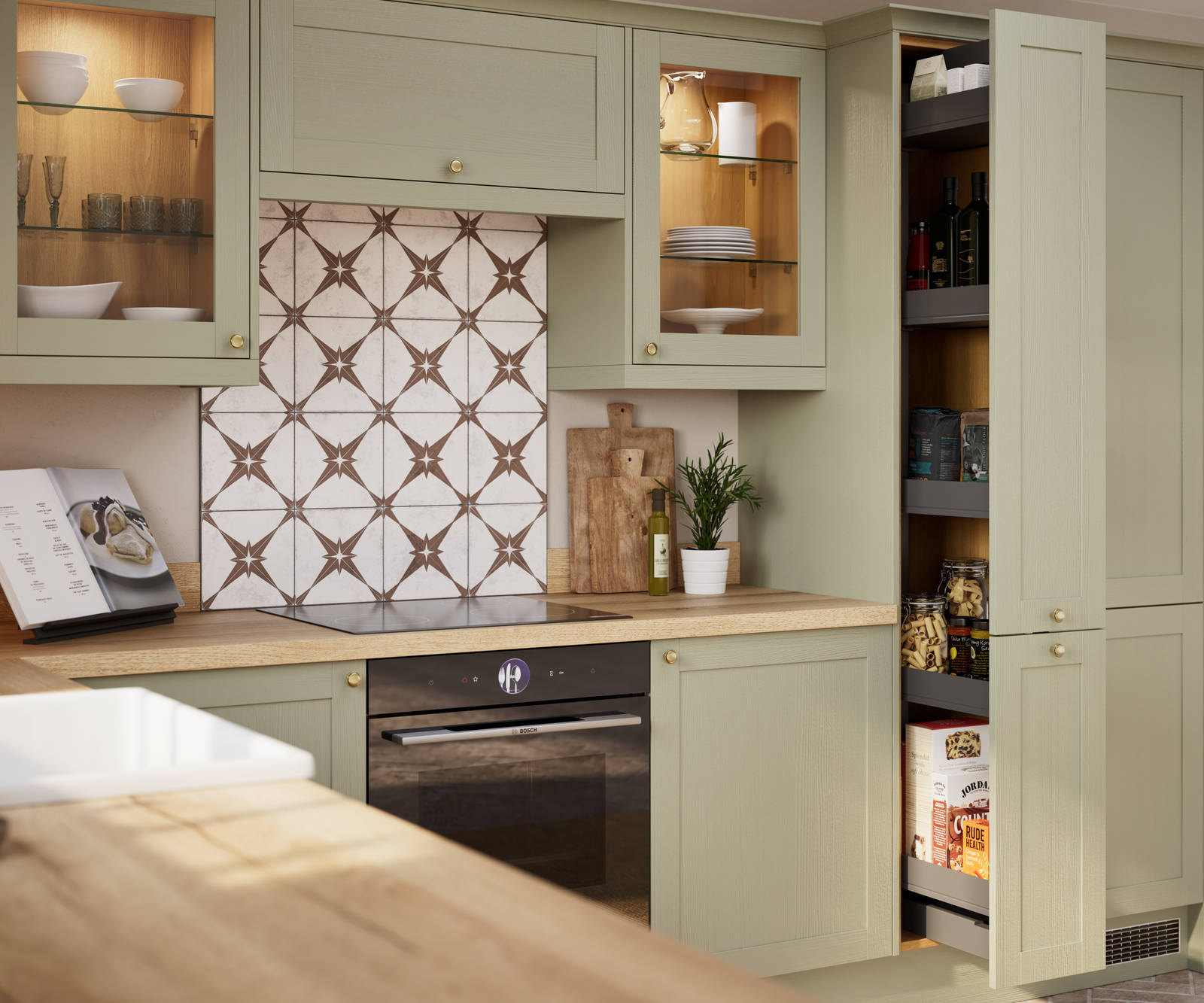 Opened pull-out larder in contemporary Shaker kitchen Ambleside from Magnet in sage green shade Meadow with belfast sink, aged taps and wooden effect worktop.