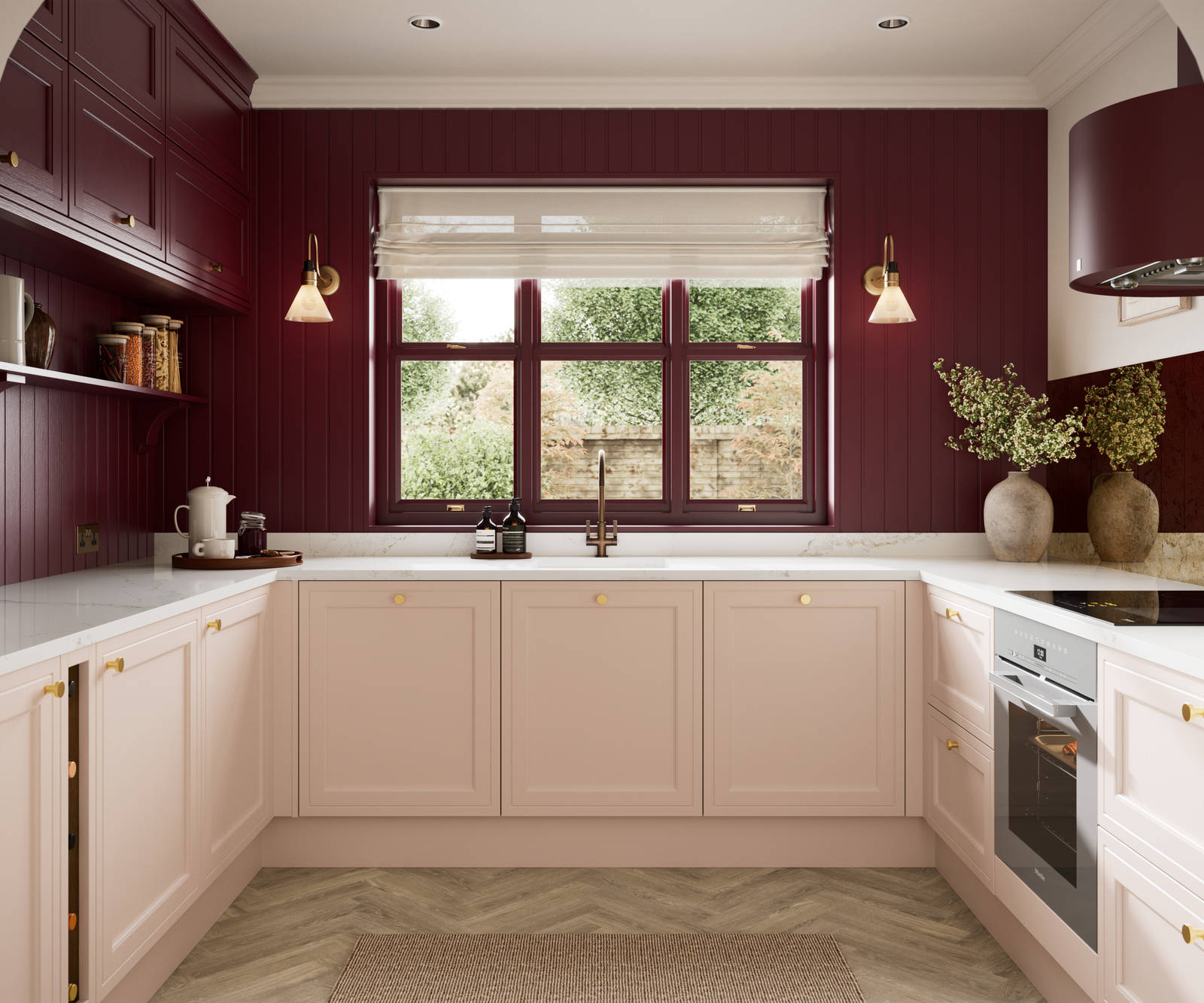 Painted wood grain Shaker style Bewdley kitchen with cabinets in light pink shade Chalk Blush, marbled worktop, brass knobs, red Morello wall-mounted cabinets with matching shelves and wall panel, built- in wine storage.