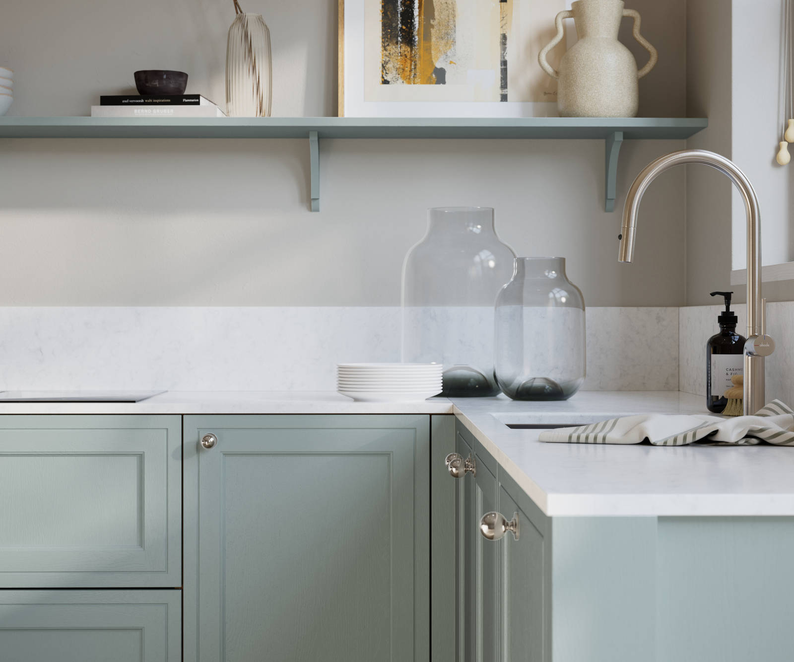 Bewdley Sky painted wood grain Shaker kitchen cabinetry with steel knobs, steel tap, white marbled worktop and matching backsplash, an open shelf on the wall above cabinets with ceramics and a vase of flowers.