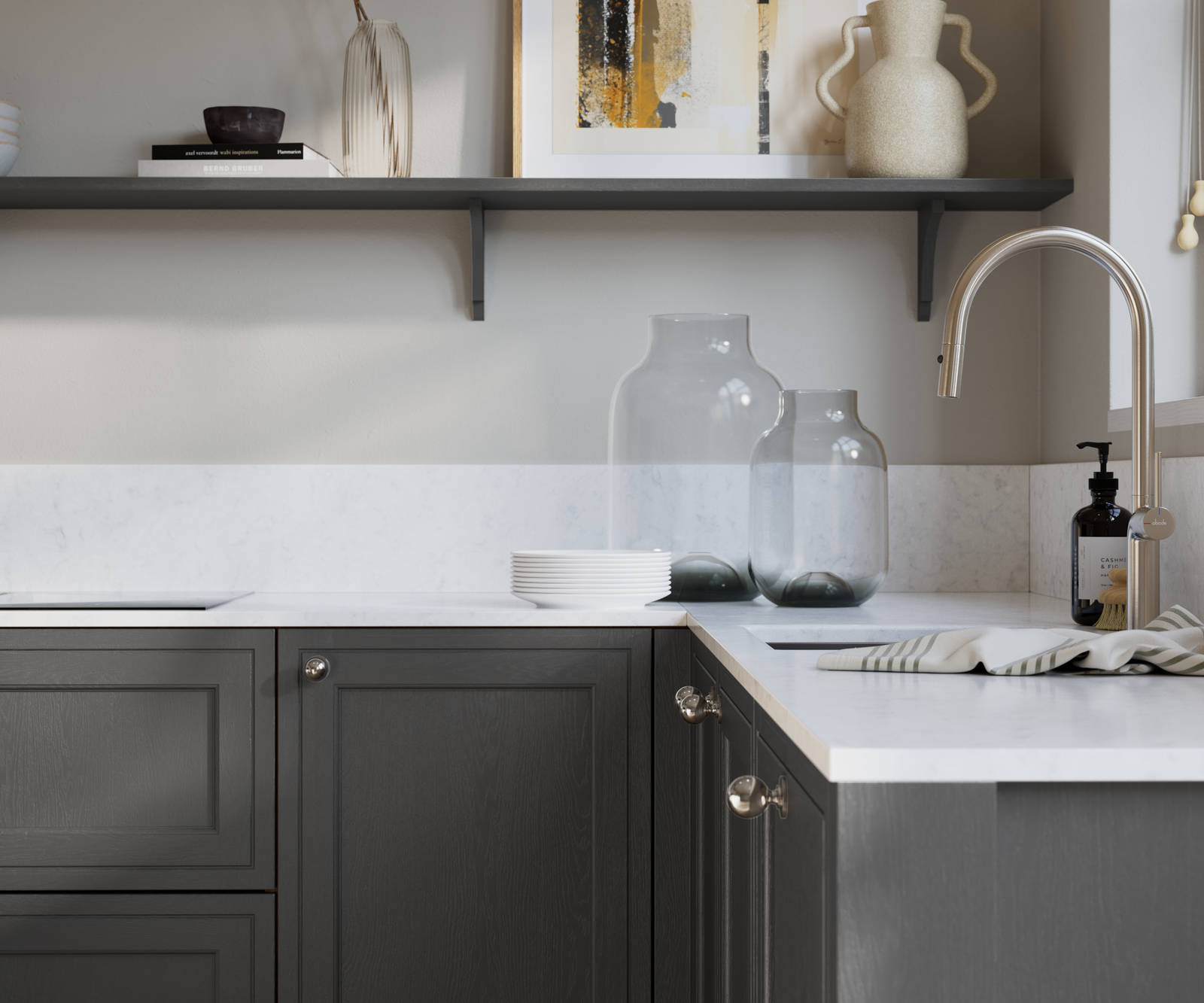 Bewdley Charcoals painted wood grain Shaker kitchen cabinetry with steel knobs, steel tap, white marbled worktop and matching backsplash, an open shelf on the wall above cabinets with ceramics and a vase of flowers.