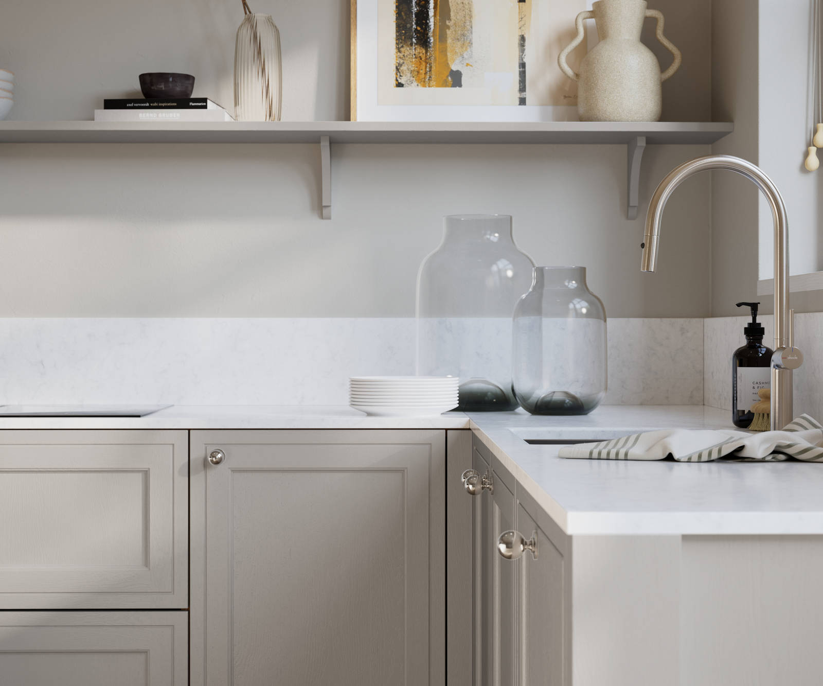 Bewdley Dove Grey painted wood grain Shaker kitchen cabinetry with steel knobs, steel tap, white marbled worktop and matching backsplash, an open shelf on the wall above cabinets with ceramics and a vase of flowers.