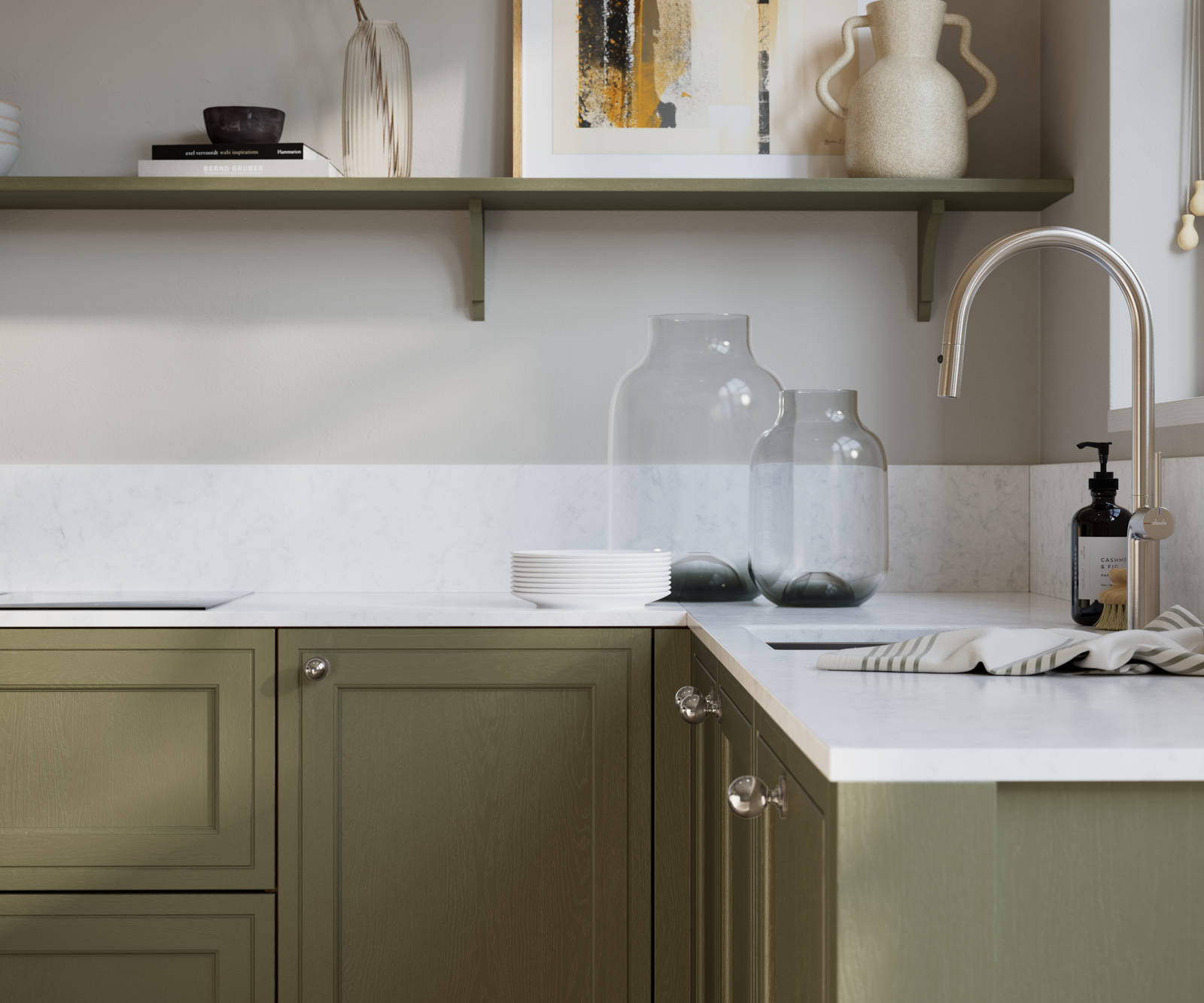 Bewdley Balmoral painted wood grain Shaker kitchen cabinetry with steel knobs, steel tap, white marbled worktop and matching backsplash, an open shelf on the wall above cabinets with ceramics and a vase of flowers.