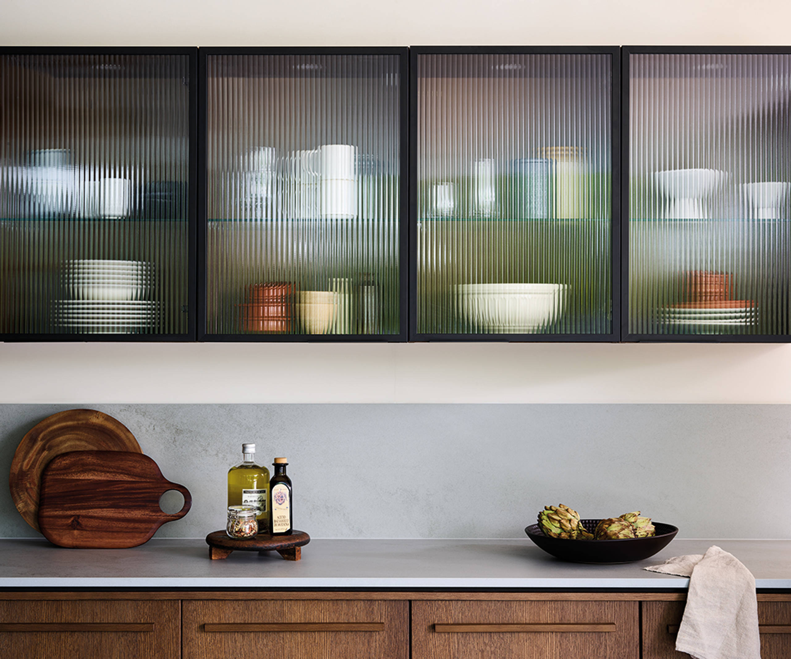 Nordic Nature. Modern wooden kitchen design with a Nordic influence. Featured floating worktops, a ribbed plinth and rounded end panels.