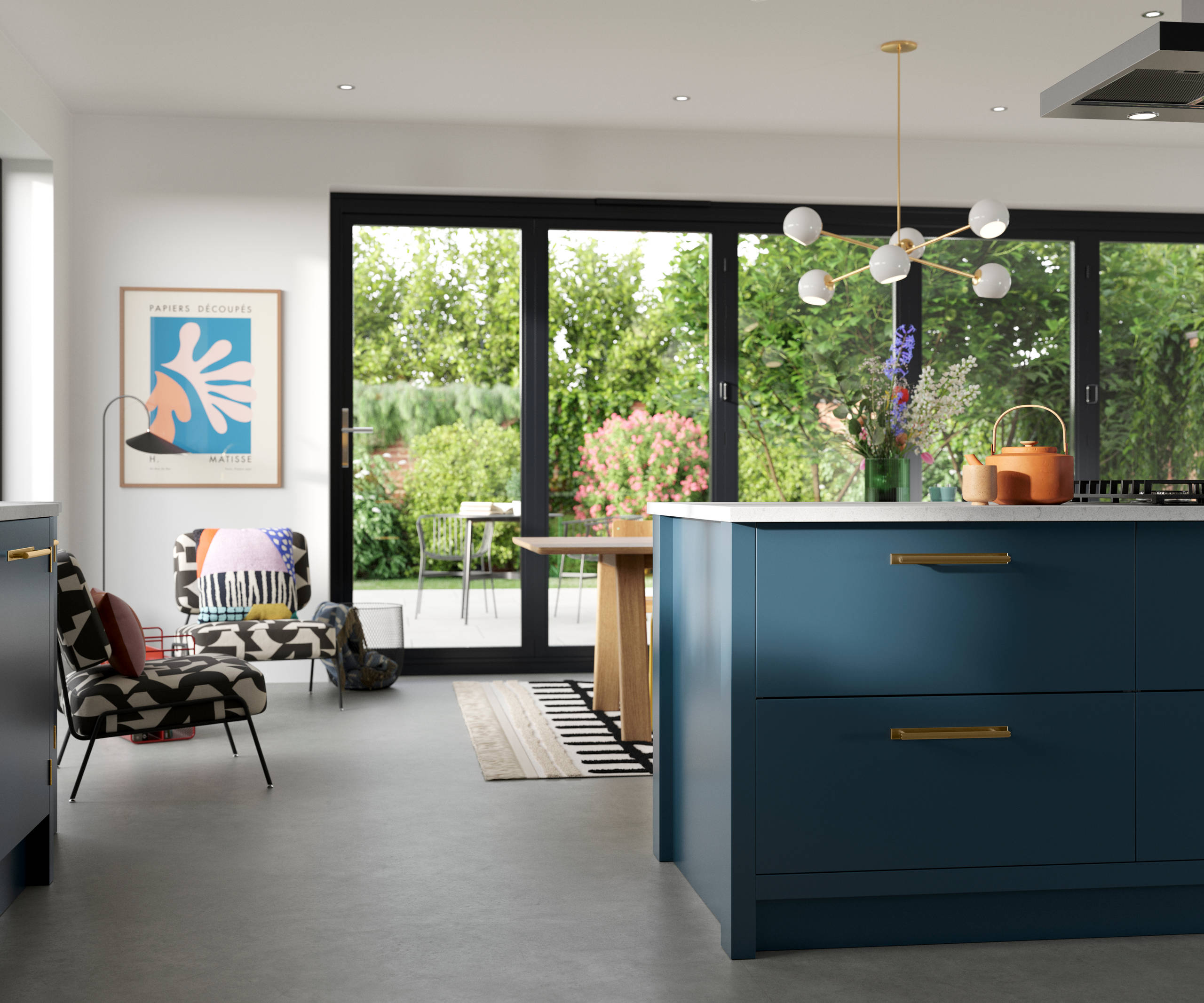 View of kitchen island in Soho Voyage Blue kitchen  with brass handles.