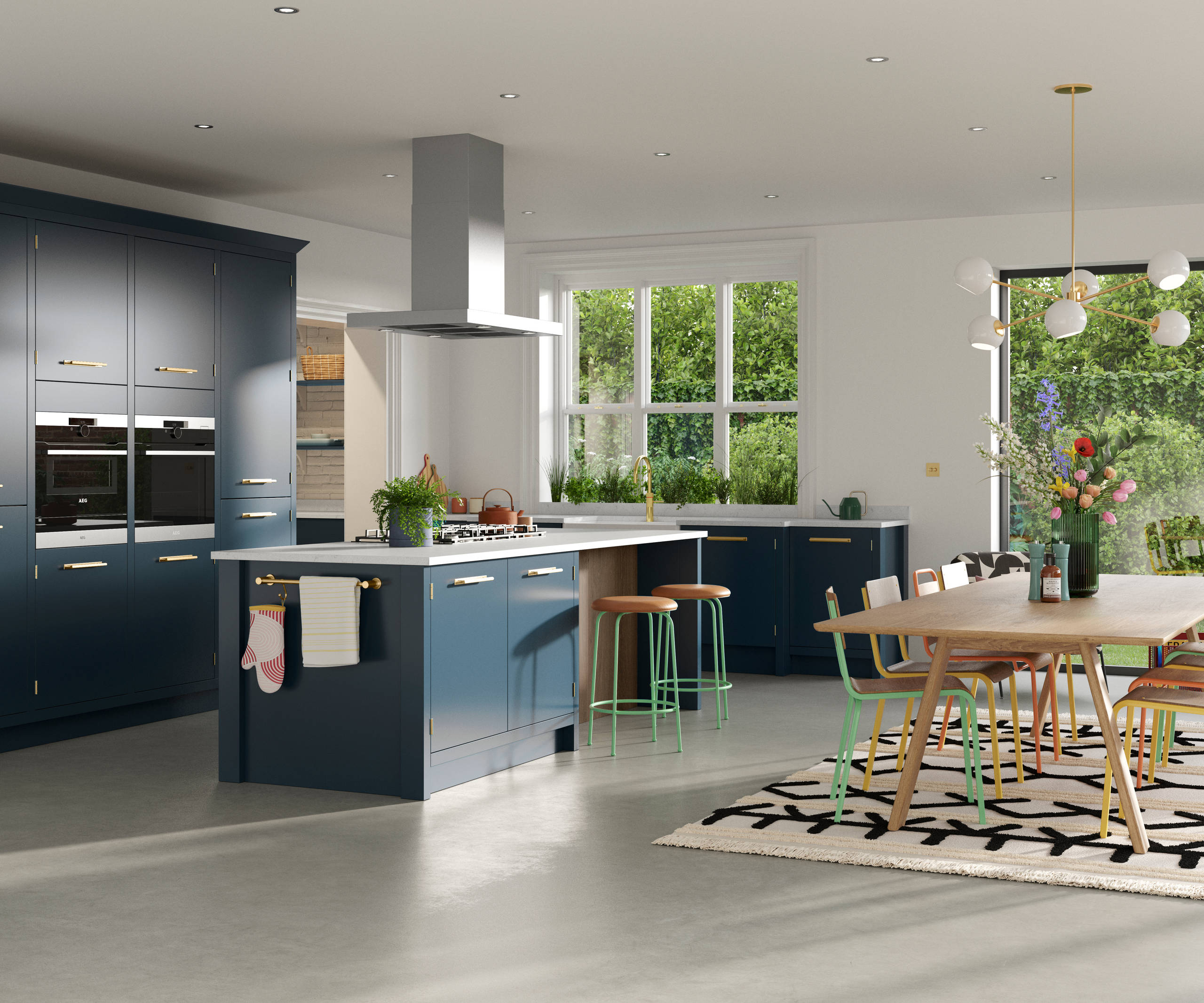 Full room view of Soho Voyage Blue kitchen with contemporary dining room table and chairs in bright colours.