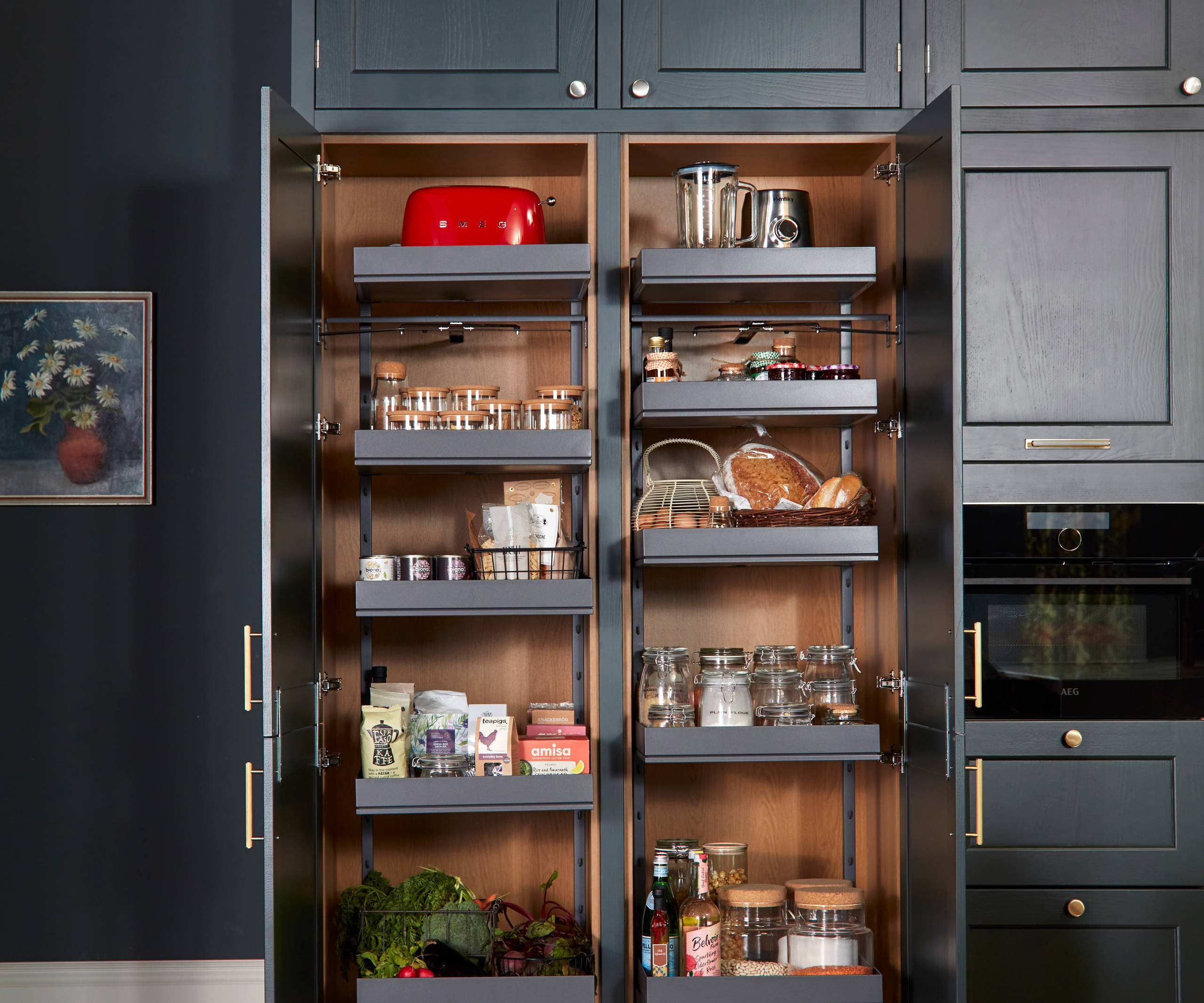 Ludlow, a traditional Shaker-style kitchen range in the shade Arboretum Green with straight kitchen larder pull out