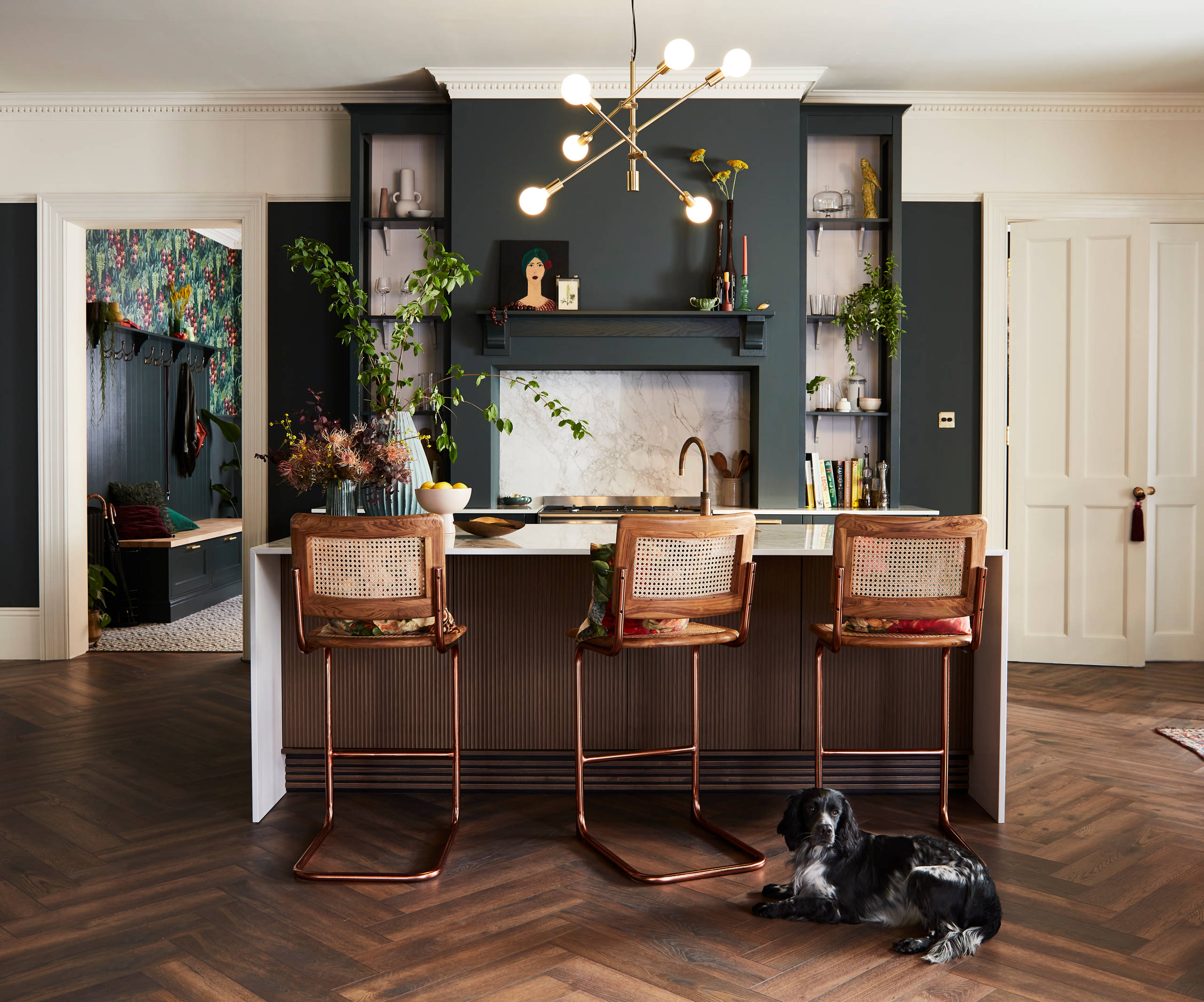 Ludlow, a traditional Shaker-style kitchen range in the shade Arboretum Green, combined with a dark wood panel kitchen island