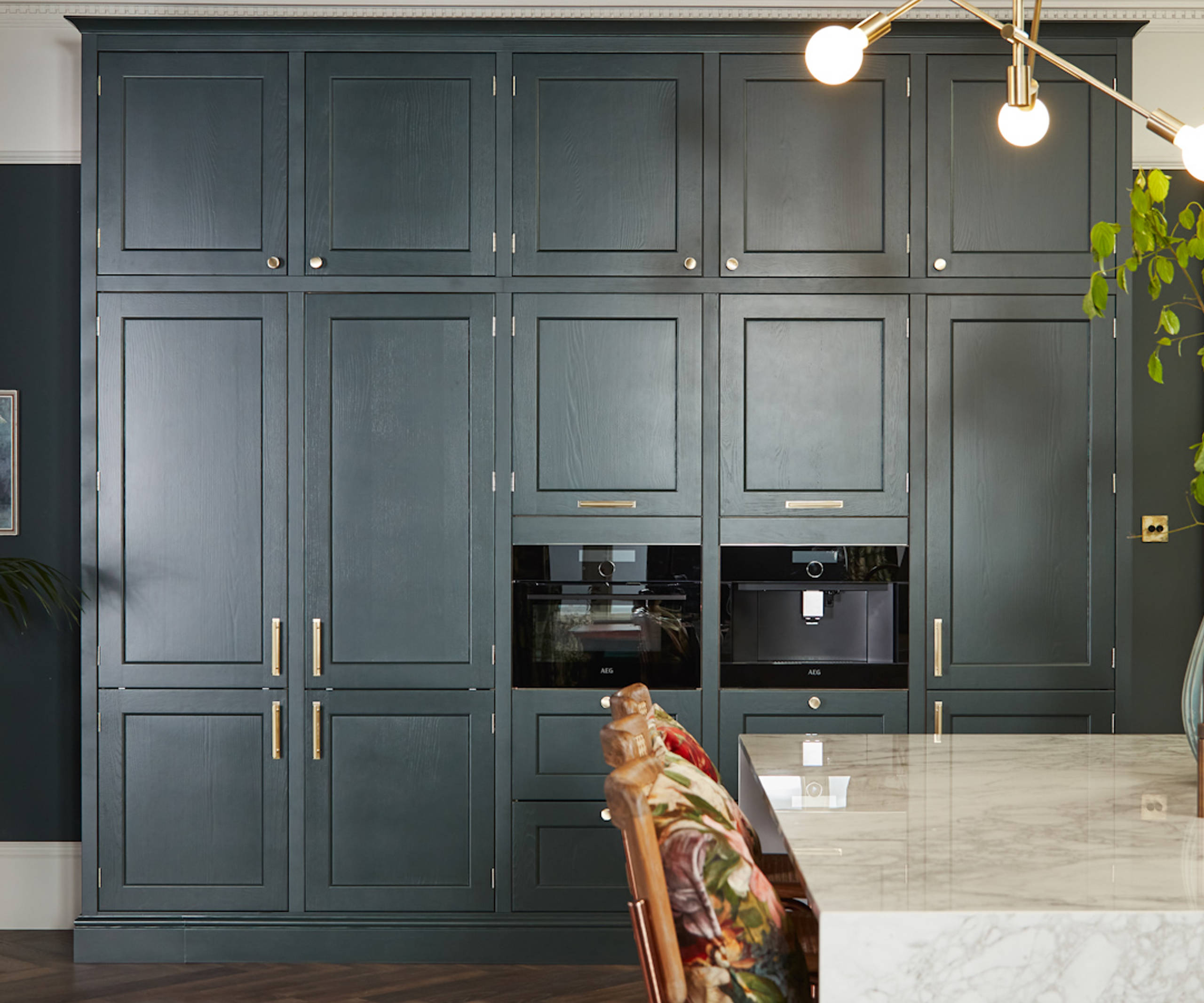 Ludlow, a traditional Shaker-style kitchen range in the shade Arboretum Green, tall cabinets