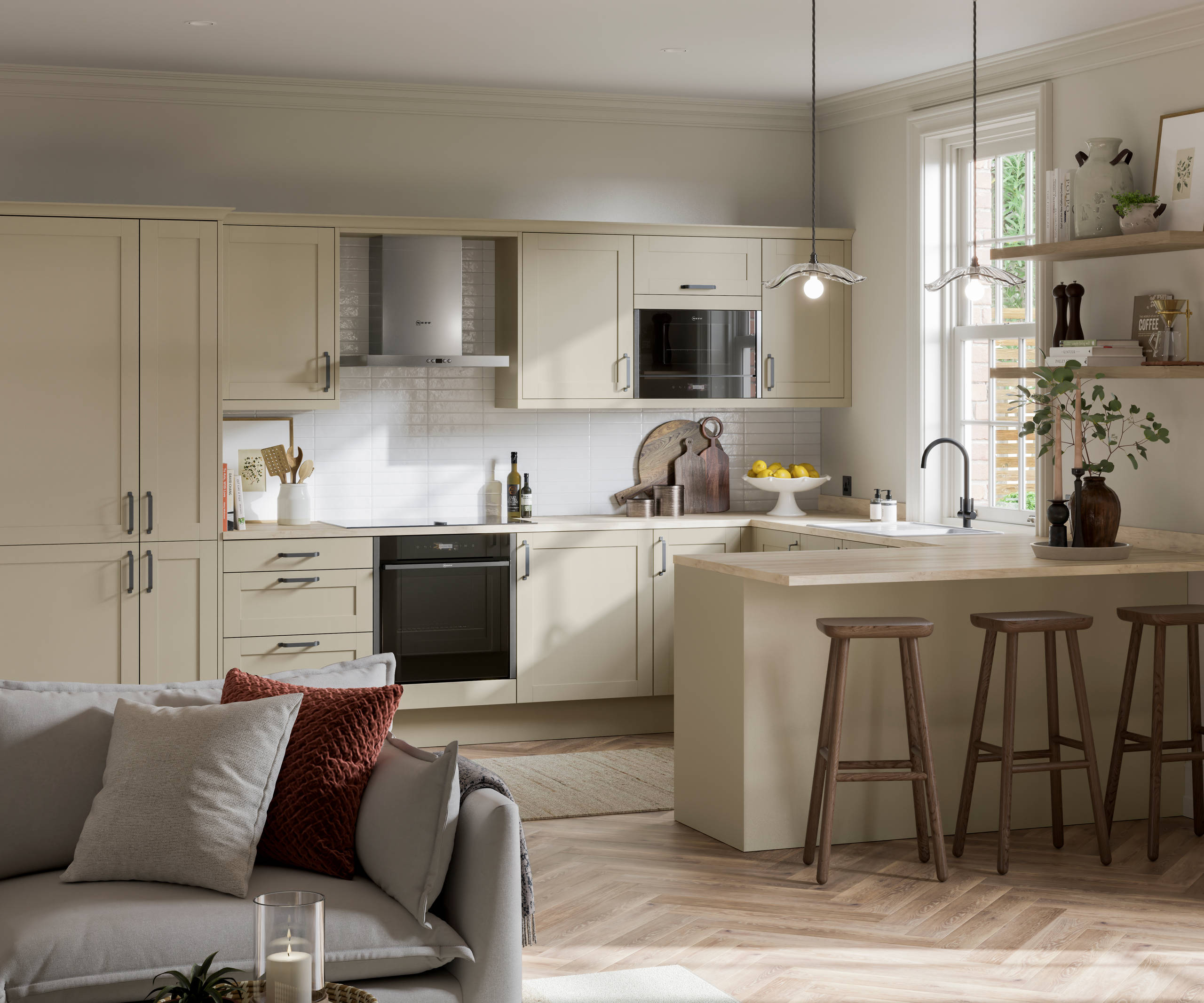 Tatton Sage from Magnet, a contemporary narrow frame shaker door, with a grey sofa in the foreground