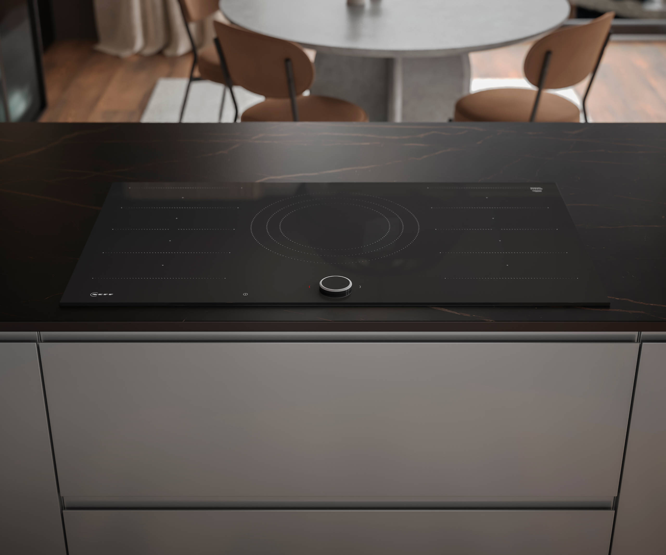 An overhead view of a sleek glass Neff hob, with modern Duxbury kitchen drawers that include an integrated J-pull handle.