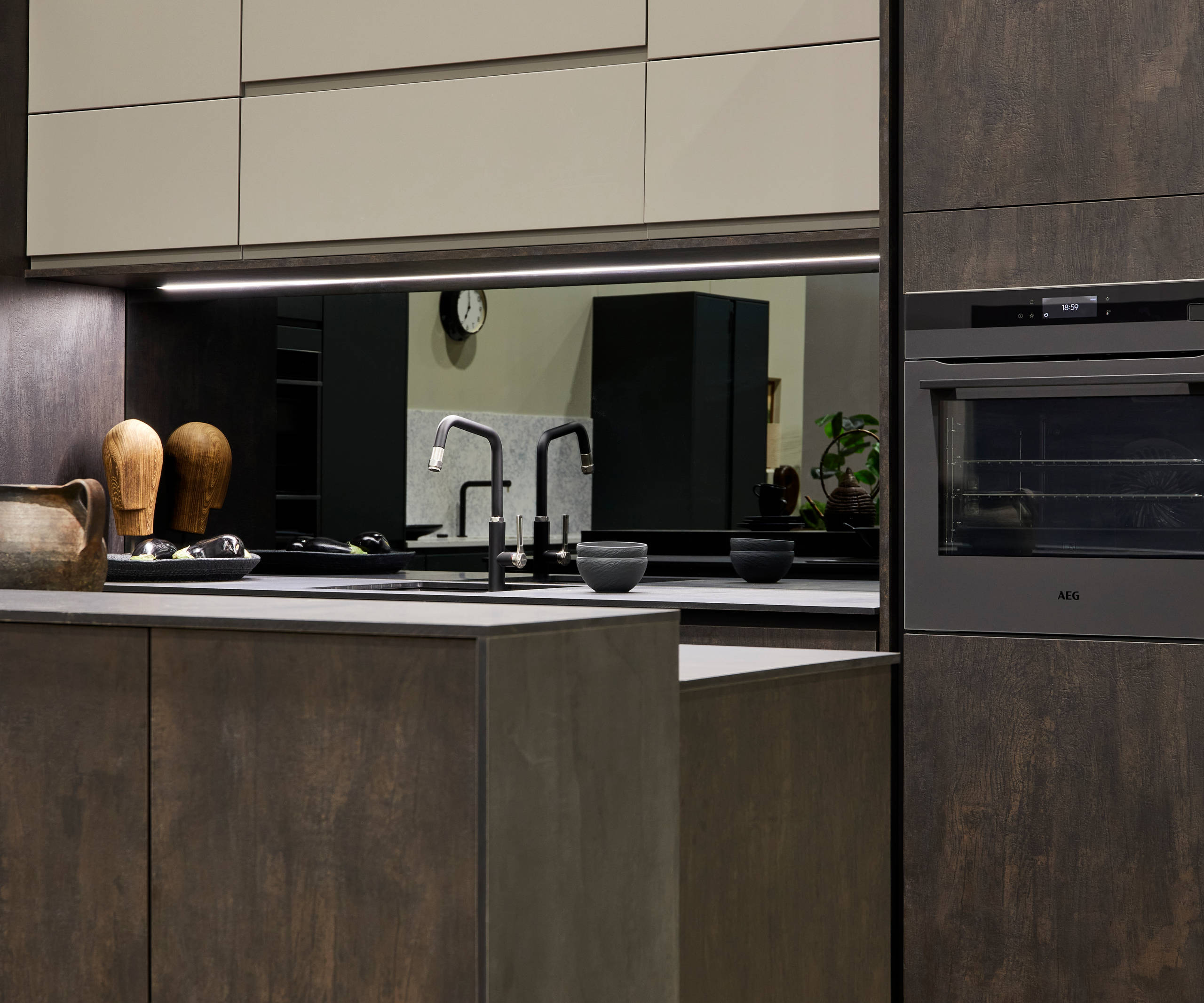 Contemporary clean lines and organic woodgrain texture in an elegant kitchen range designed for modern living.