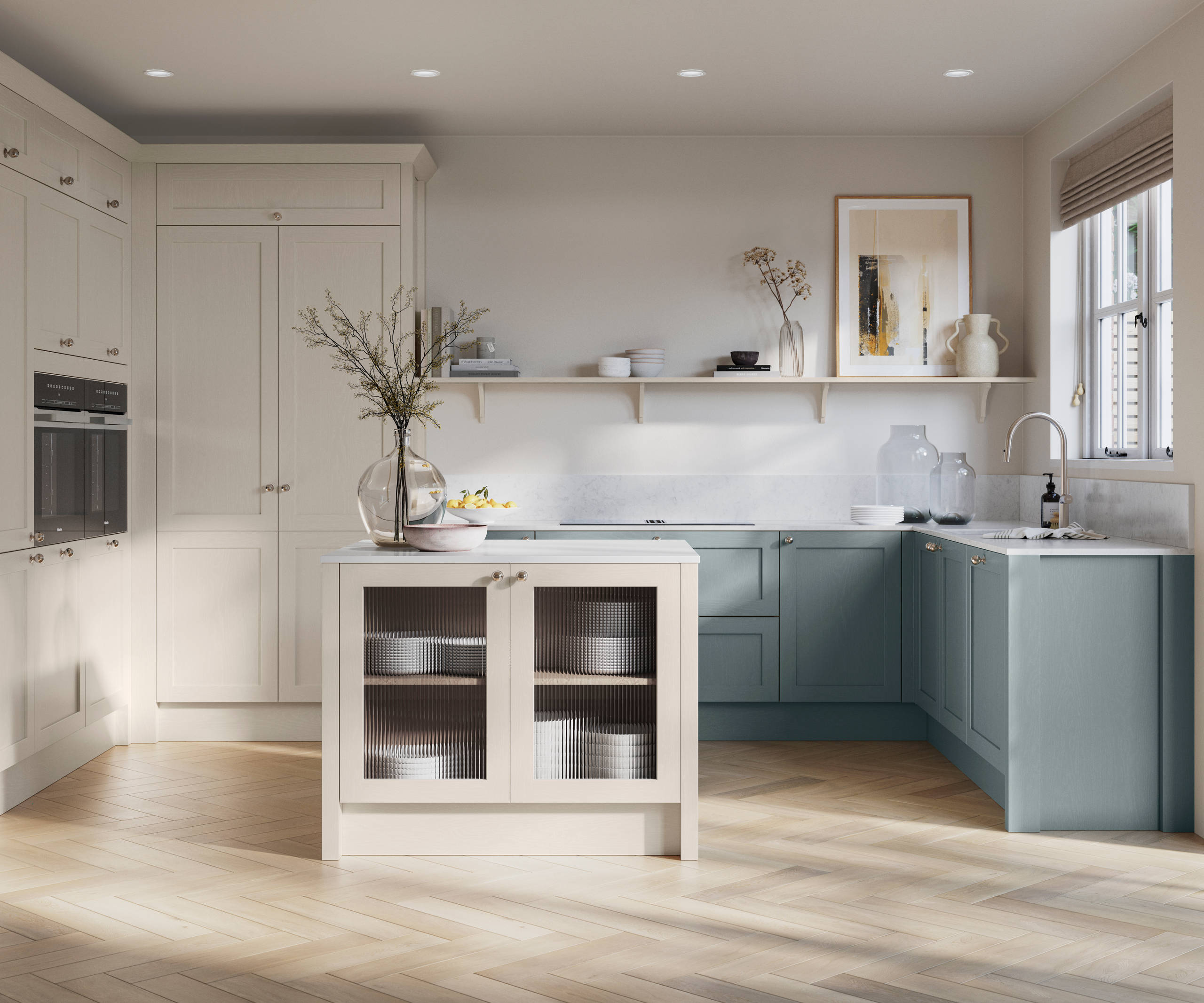 Open floorplan kitchen with small kitchen island in Wardley kitchen from Magnet in the light shade Limestone as well as blue Duck egg, decorated with flowers in glass vases and earth toned ceramics.