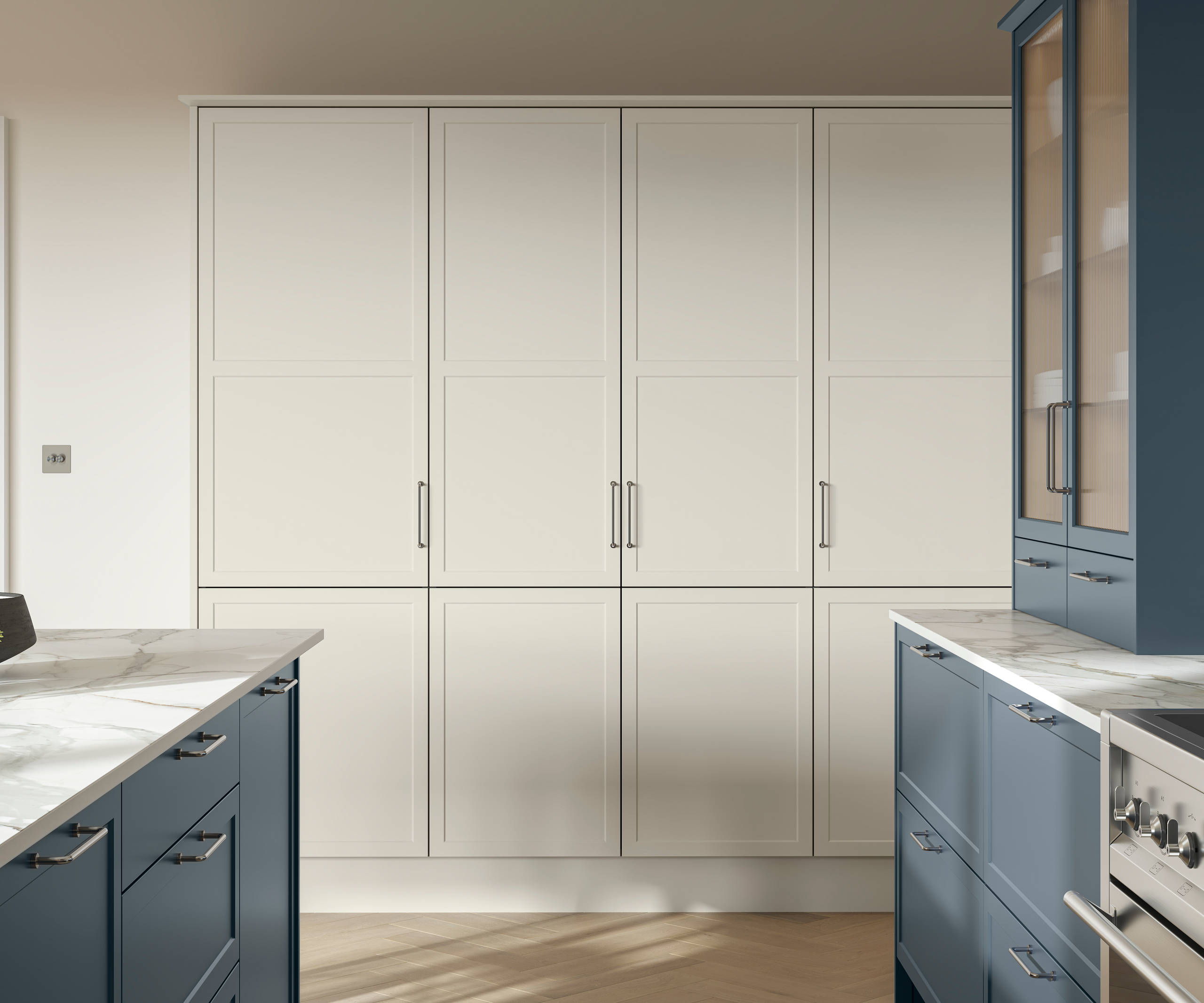 Modern Shaker kitchen Brunswick with kitchen island in shade Voyage Blue and tall cabinetry in shade Limestone, white and grey marbled worktop and steel handles.