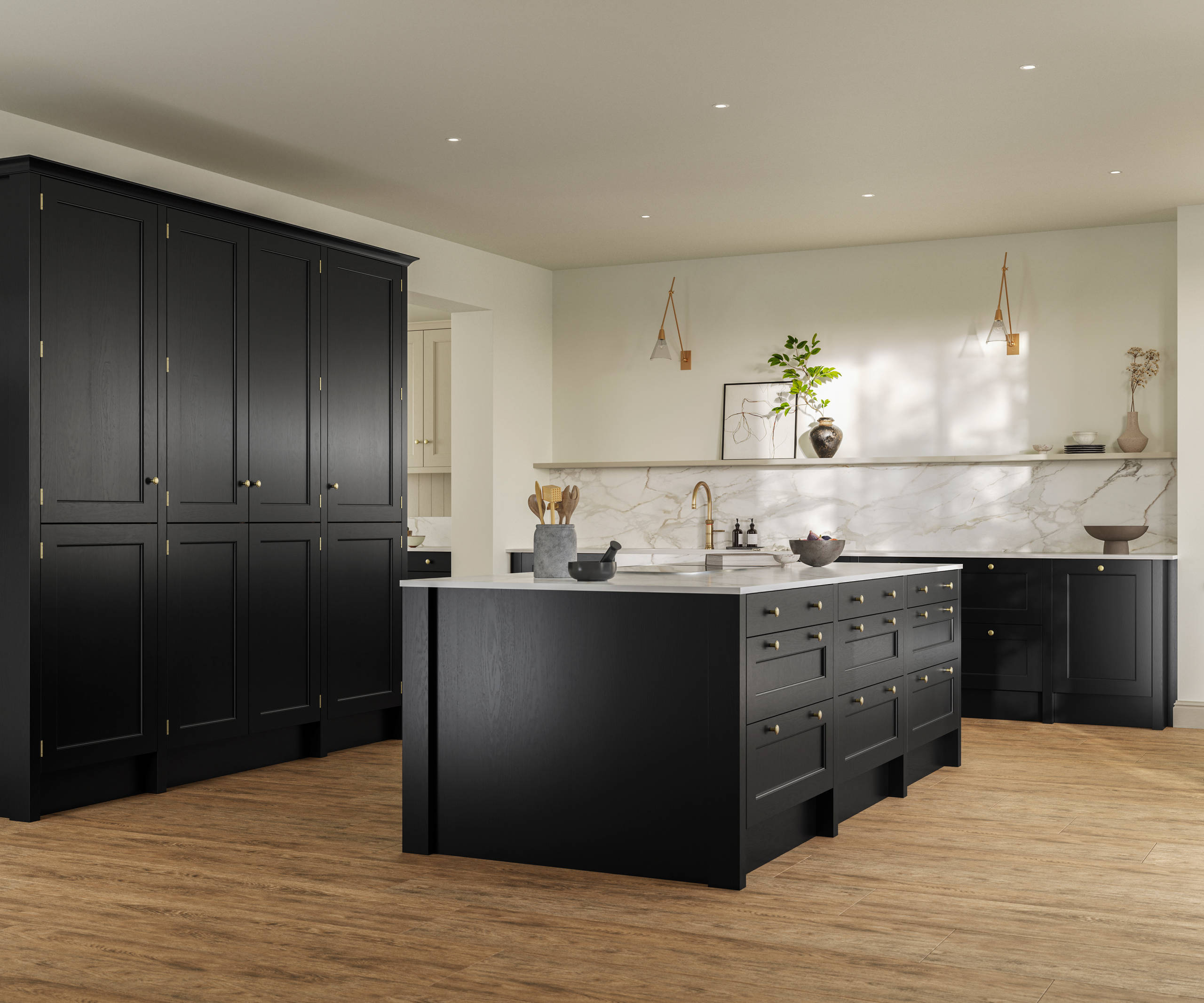 Traditional Shaker-style tactile woodgrain Ludlow Sumi Black kitchen with tall cabinets and kitchen island, brass accessories, marbled white and grey worktop, Amtico oak stripwood vinyl flooring.