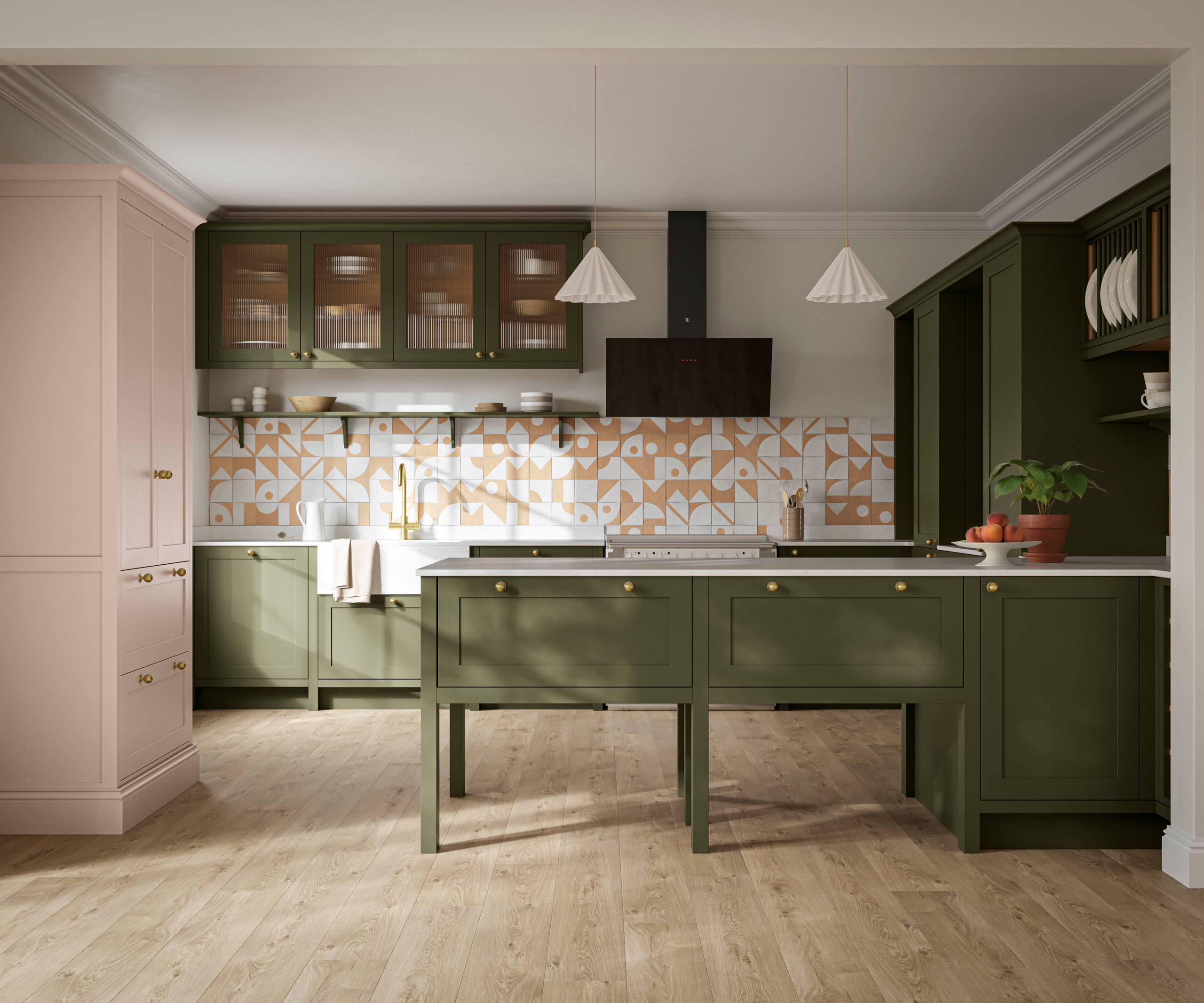 Premium Shaker kitchen Wardley Tailored green with traditional detailing, brass accessories, fluted glass wall vitrine cabinets, standalone Wardley Chalk Blush pantry, Classic Flint Grey oiled oak engineered wood flooring.
