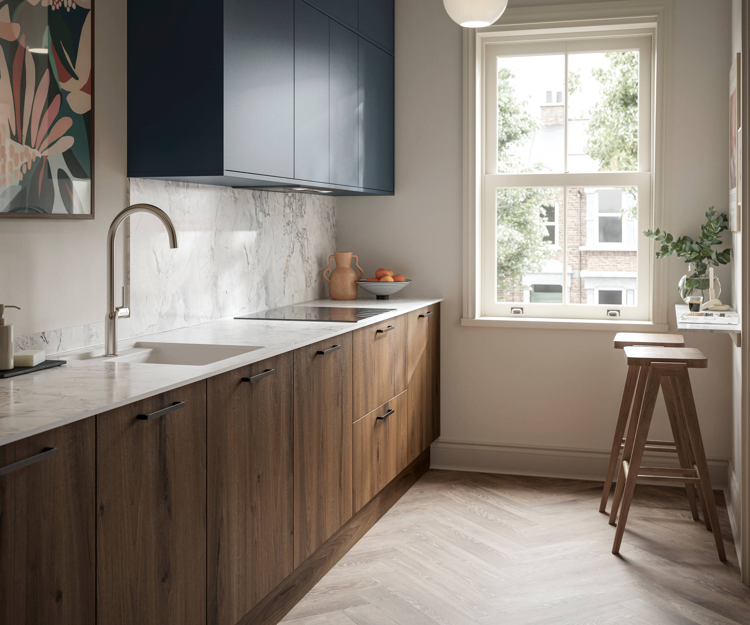 Contemporary Ascoli Mineral Blue wall cabinets over Portobello Umbra kitchen cabinets with marbled compact laminate worktop, black handles, a breakfast bar with wood bar stools, and Amtico smouldered oak herringbone flooring.