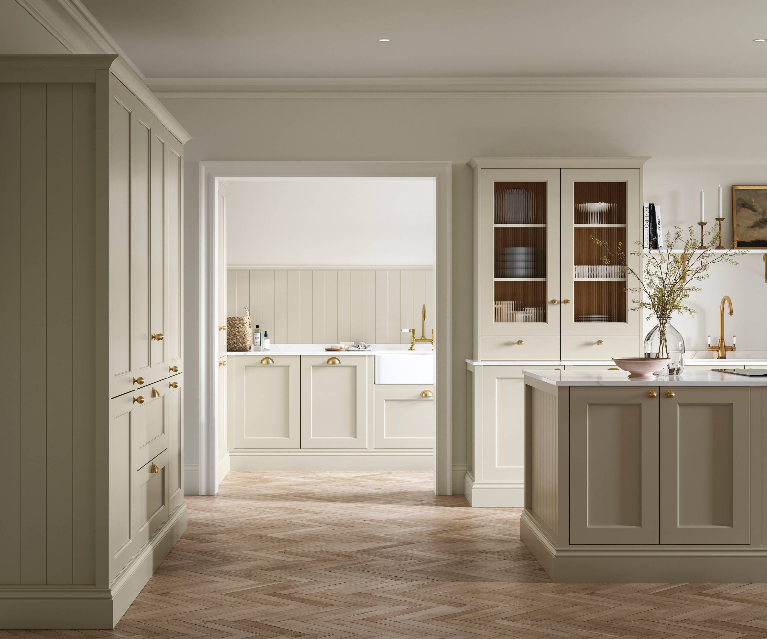 Open plan living room and Traditional Shaker-style kitchen Ludlow Parchment and view of utility room with white ceramic trough door frame, Goodrich Natural Oak herringbone engineered flooring, brass handles, brass knobs and bras tap.