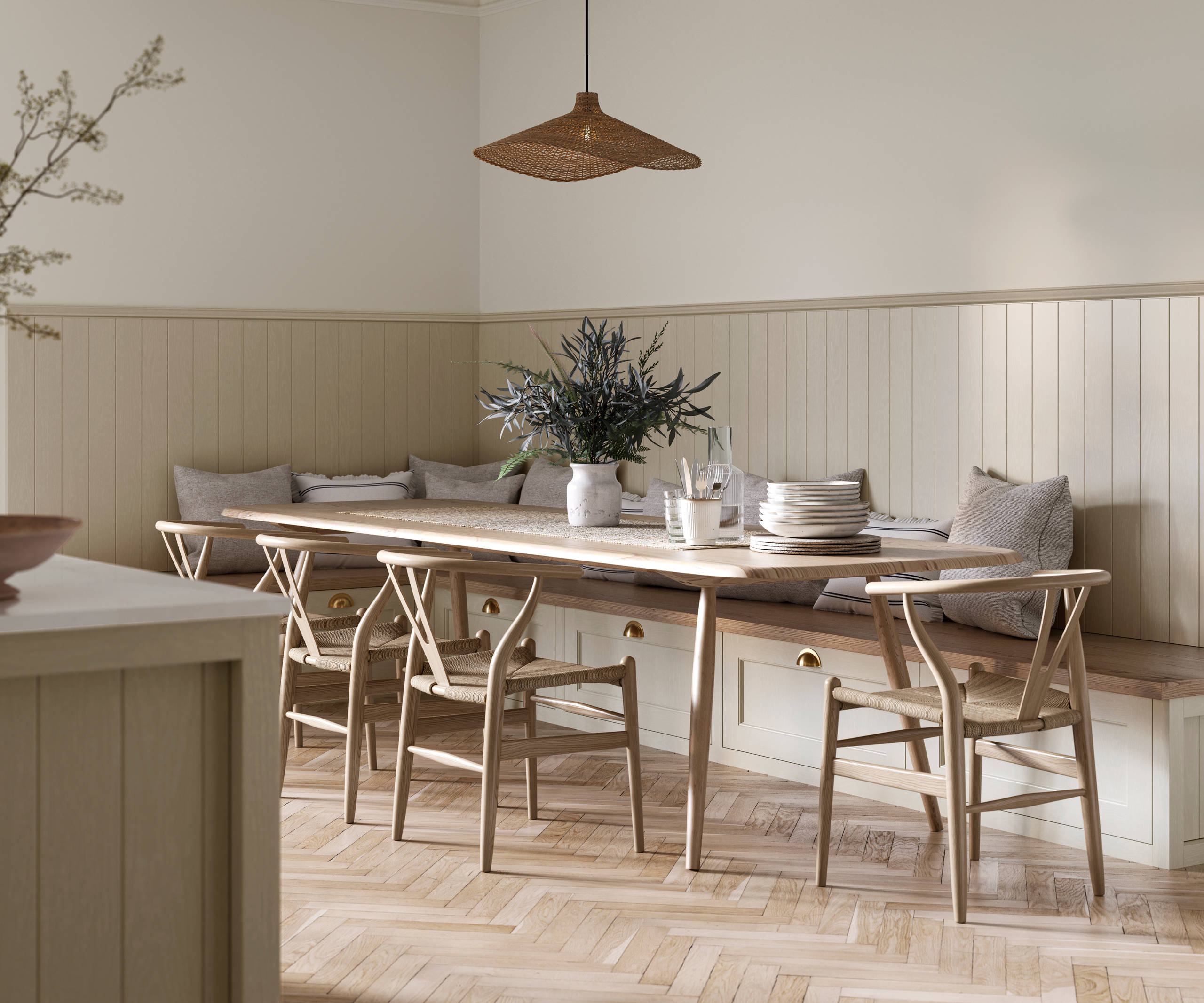 Traditional Shaker-style Ludlow Parchment bench cabinets with tactile woodgrain, a kitchen island and matching wall panel, a long wood diningroom table with matching wood chairs and ceramics set out on the table.
