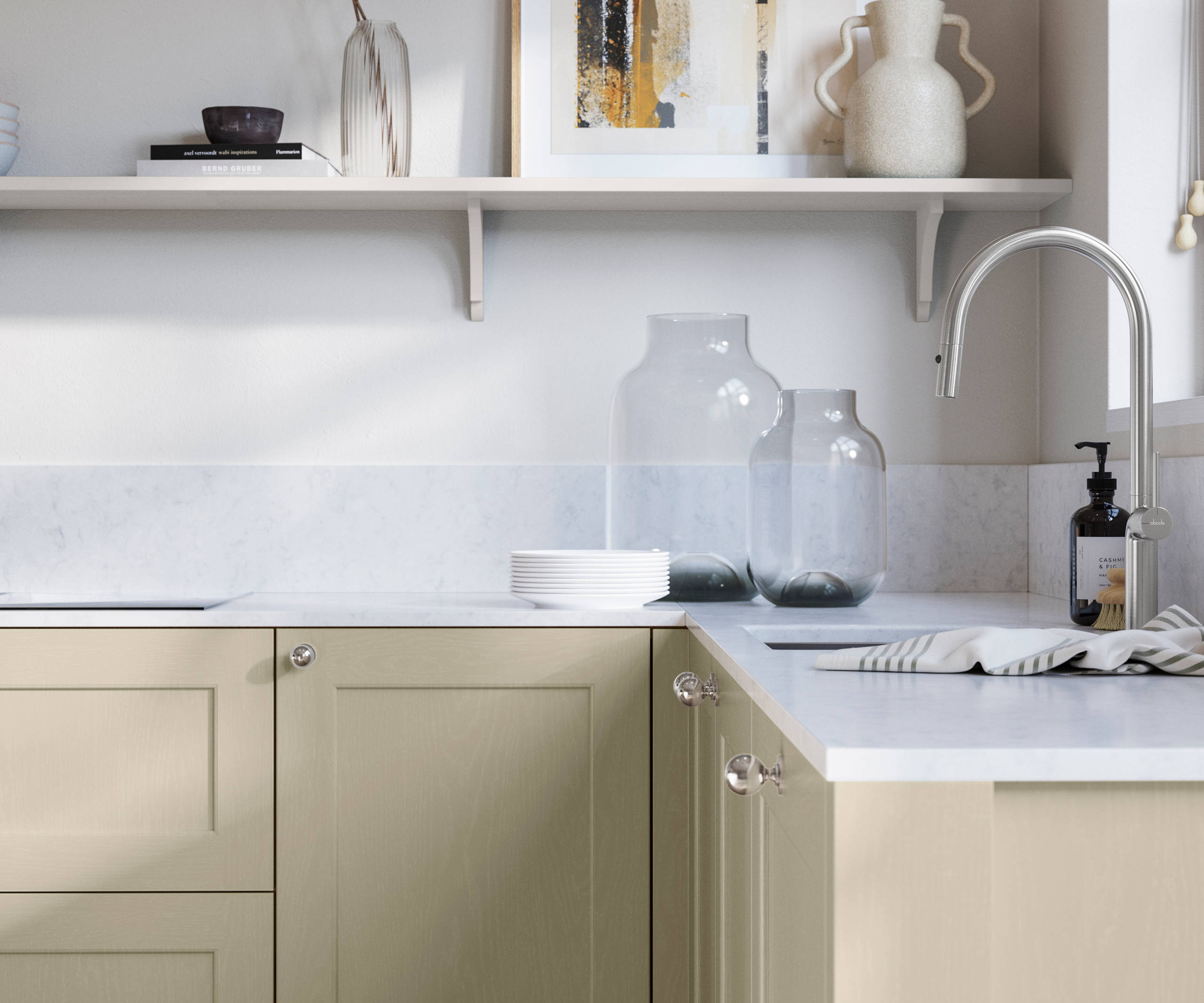 Ludlow, a traditional Shaker-style premium feel kitchen range with a visible woodgrain on its panelled doors here shown in the shade Parchment styled with steel knobs, steel tap, a white marbled worktop with matching splashback.
