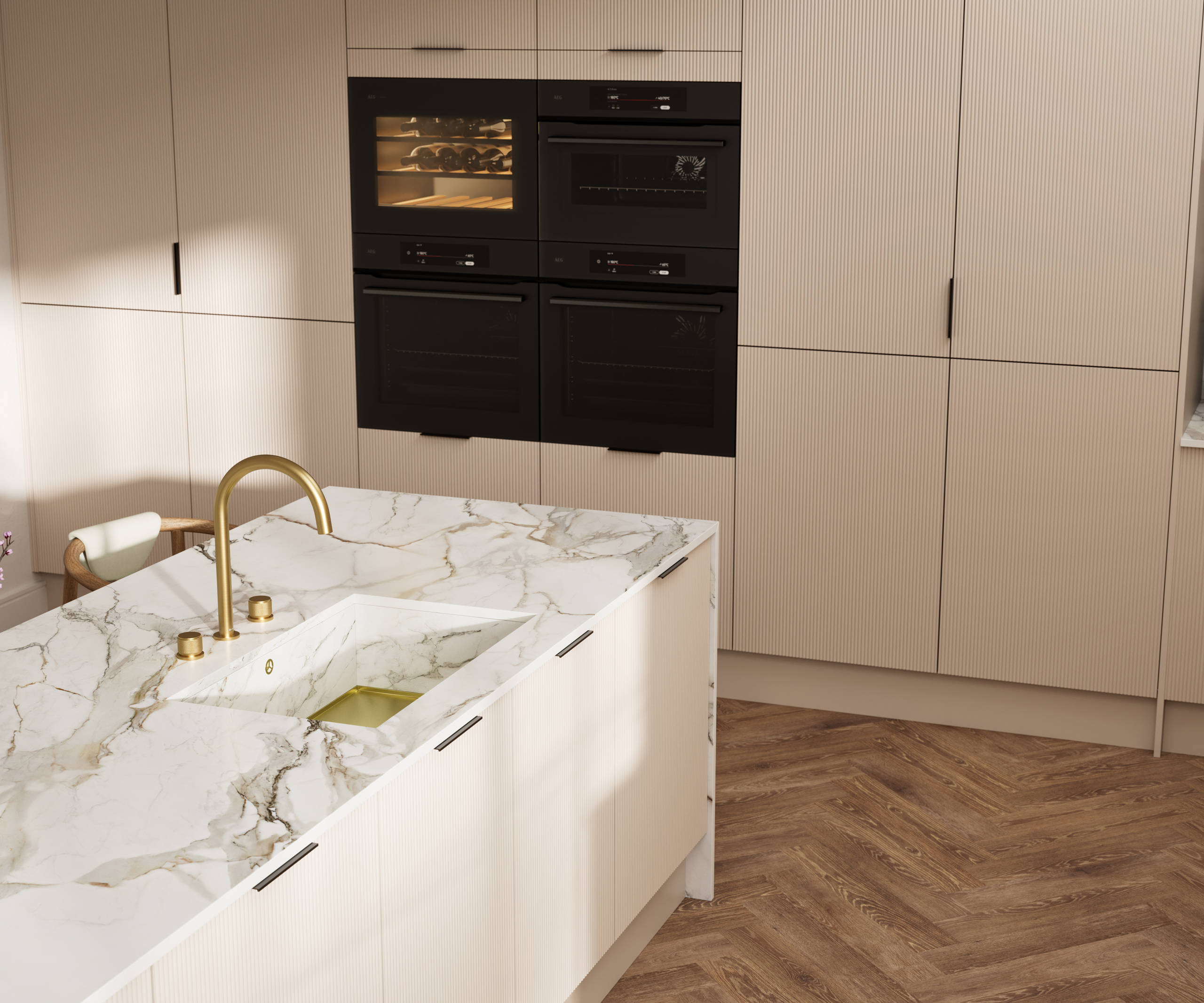 Fluted front kitchen Reed from Magnet in light warm neutral shade Shell, with a marbled splashback and worktop, brass tap in kitchen island sink