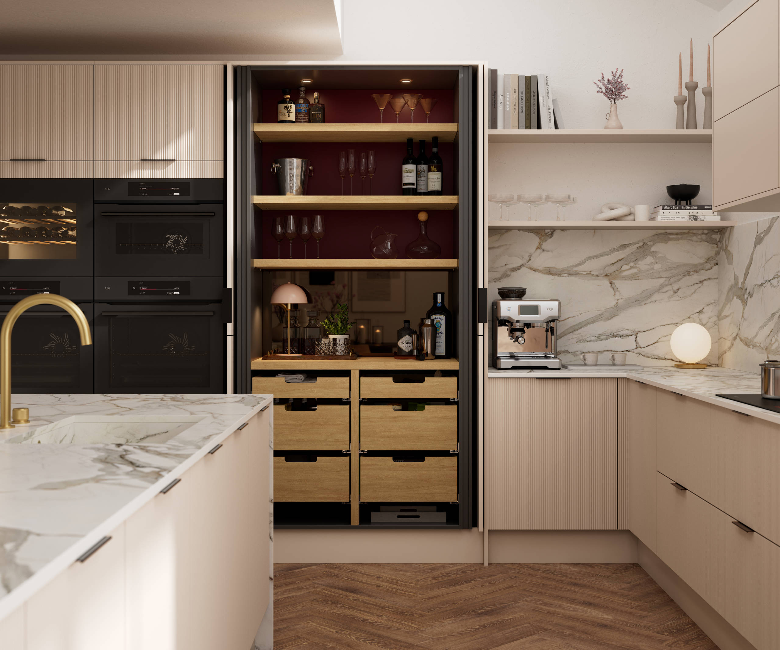 Fluted front kitchen Reed from Magnet in light warm neutral shade Shell, with a marbled splashback and worktop, opened pocket larder cabinet, black handles