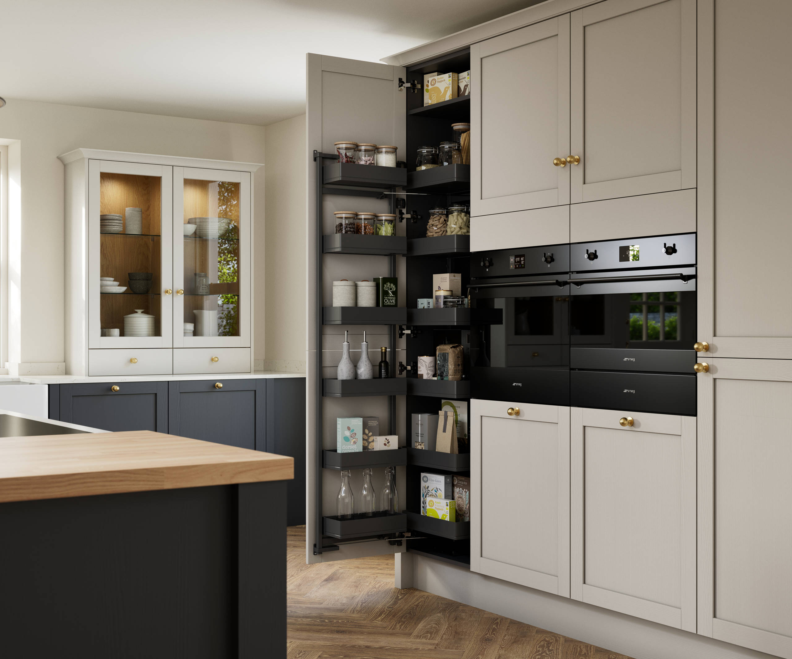 Contemporary Shaker kitchen island Ambleside from Magnet in deep blue shade Lake with beige tall cabinets, herringbone wood flooring and wood diningroom table
