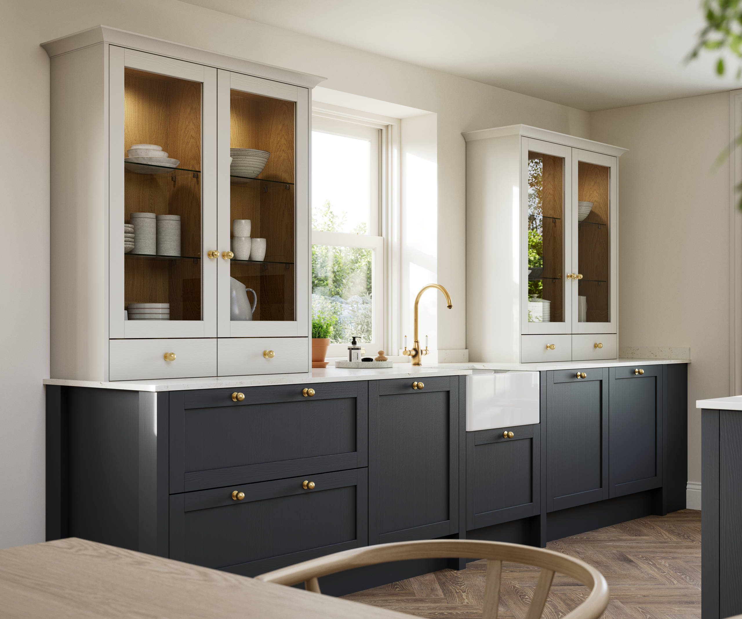 Contemporary Shaker kitchen Ambleside from Magnet in deep blue shade Lake with beige glass fronted dresser cabinets, belfast ceramic sink and brass knobs matching brass tap