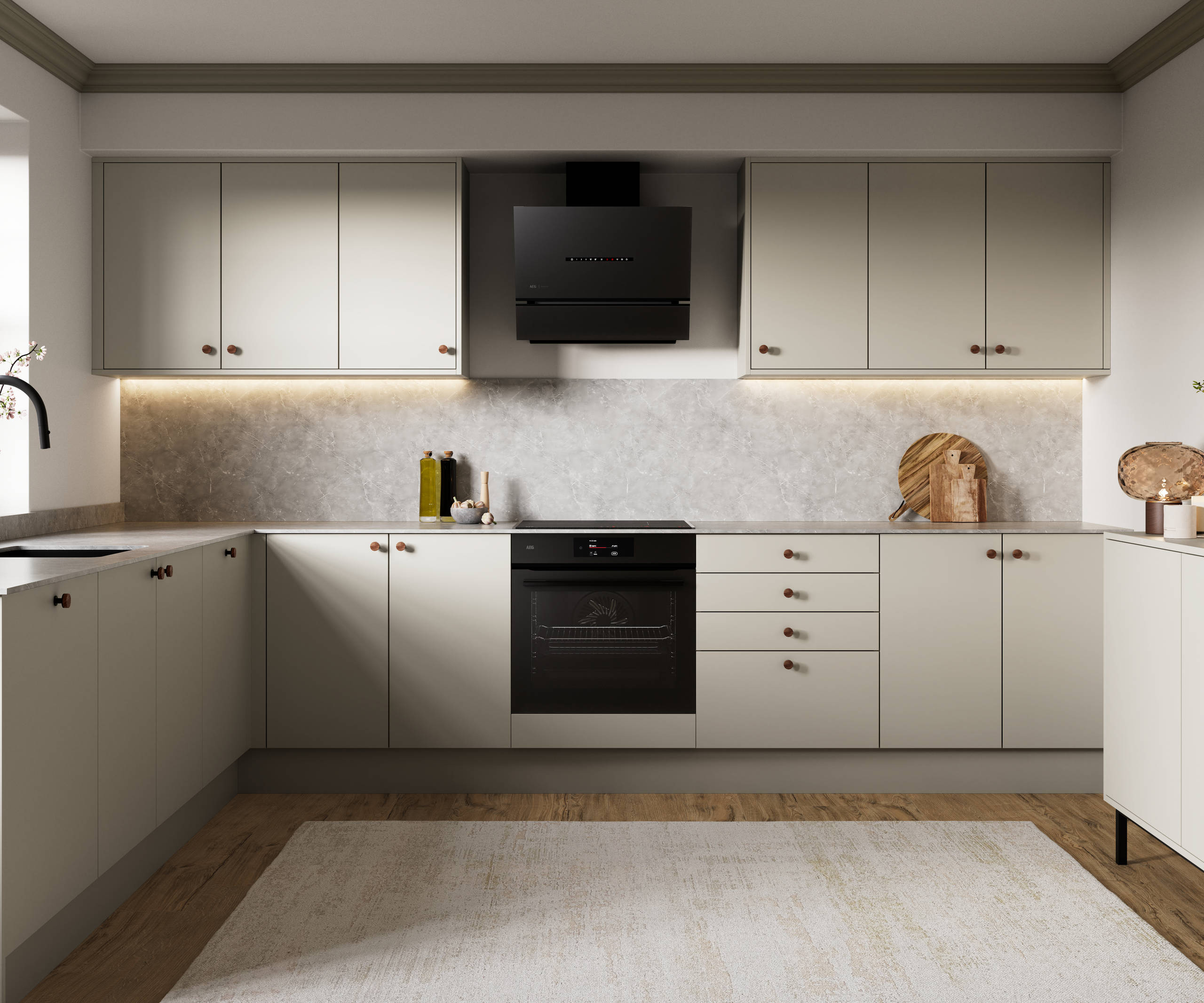 Modern slab kitchen Ascoli in neutral shade Limestone with brass knobs and black tap
