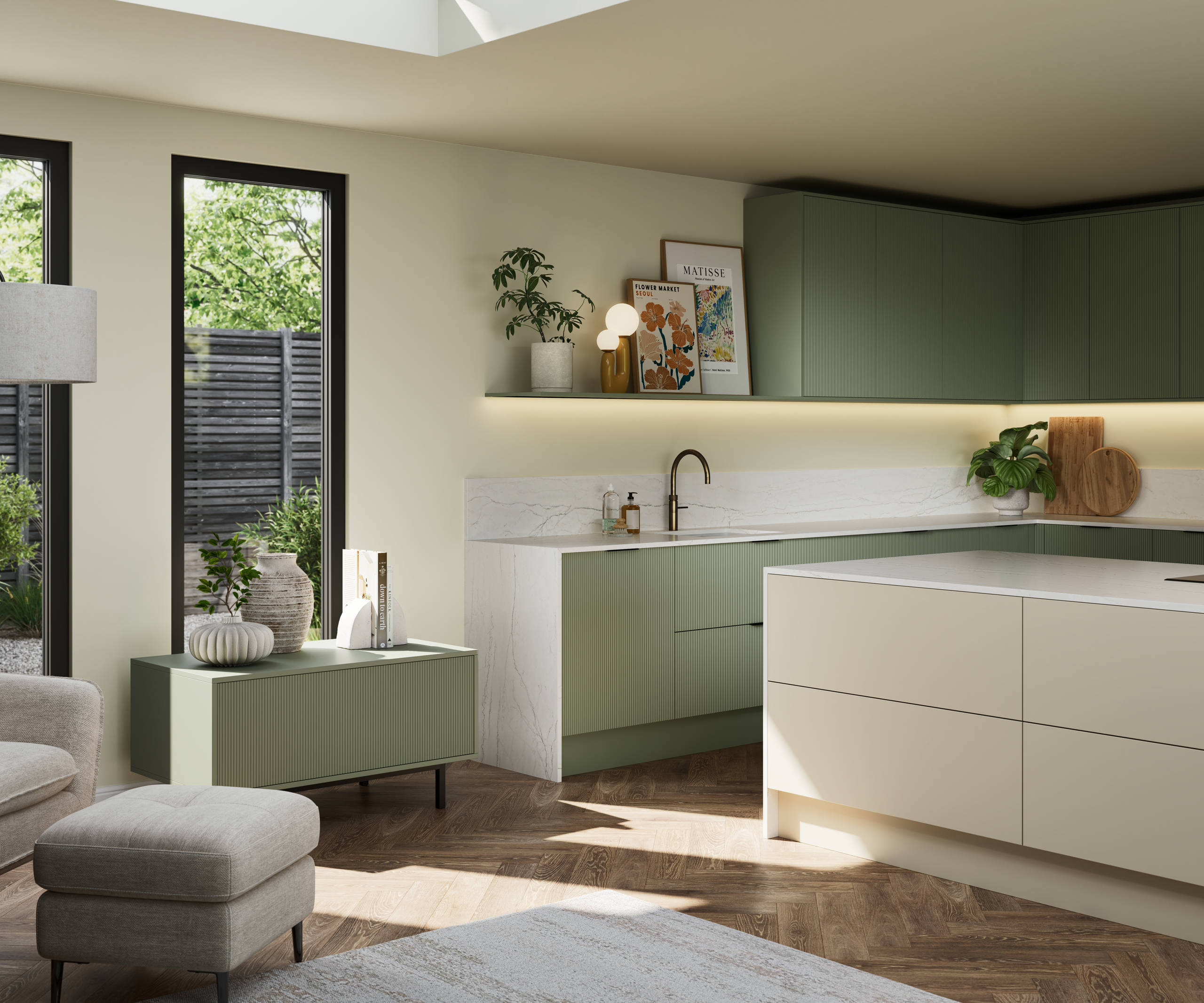 Green fluted kitchen fronts on tall cabinets with built-in appliances and black handles, light neutral shade handleless kitchen island and green sideboard on metal legs.
