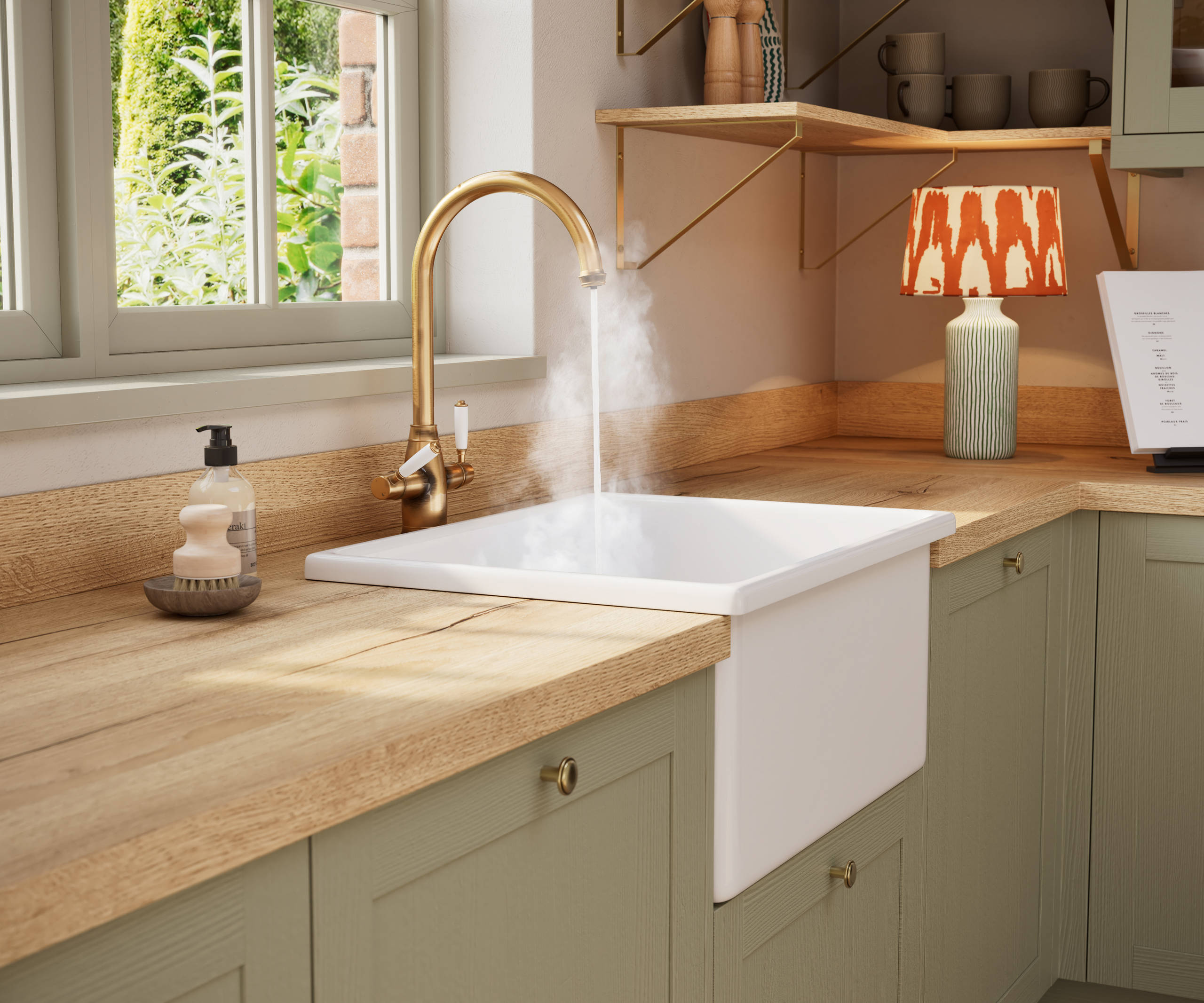 Contemporary Shaker kitchen Ambleside from Magnet in sage green shade Meadow with belfast sink and traditional style tap with hot water.