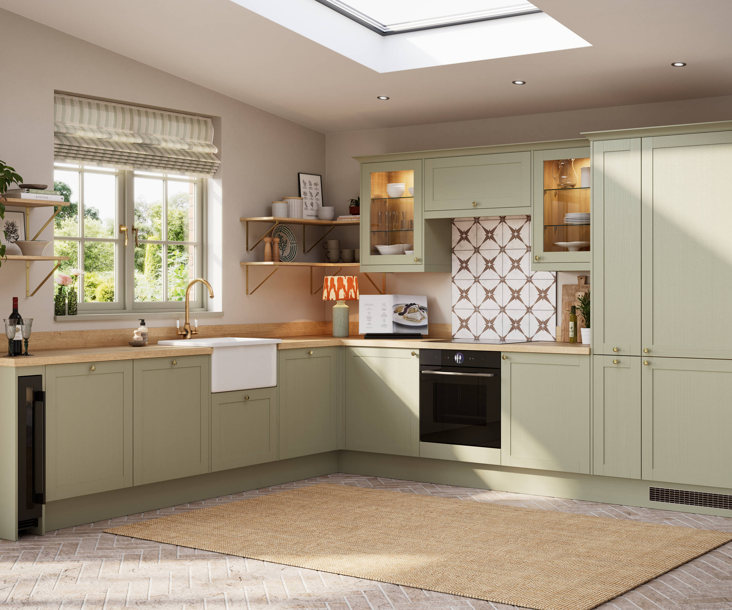 Contemporary Shaker kitchen Ambleside from Magnet in sage green shade Meadow with belfast sink, aged taps and wooden effect worktop.