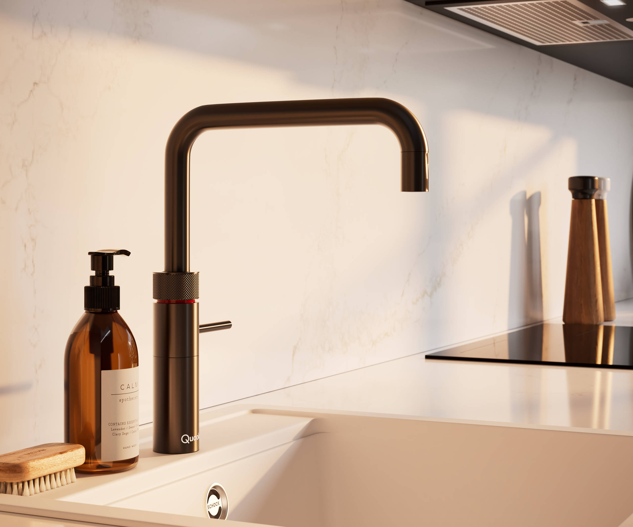 Close-up view of Quooker Fusion square 4in1 tap with boiling water in modern slab front Soho Cornish Clay kitchen from Magnet in Pantone’s colour of the year ‘Mocha Mousse’ with silestone quartz worktop and matching backsplash.