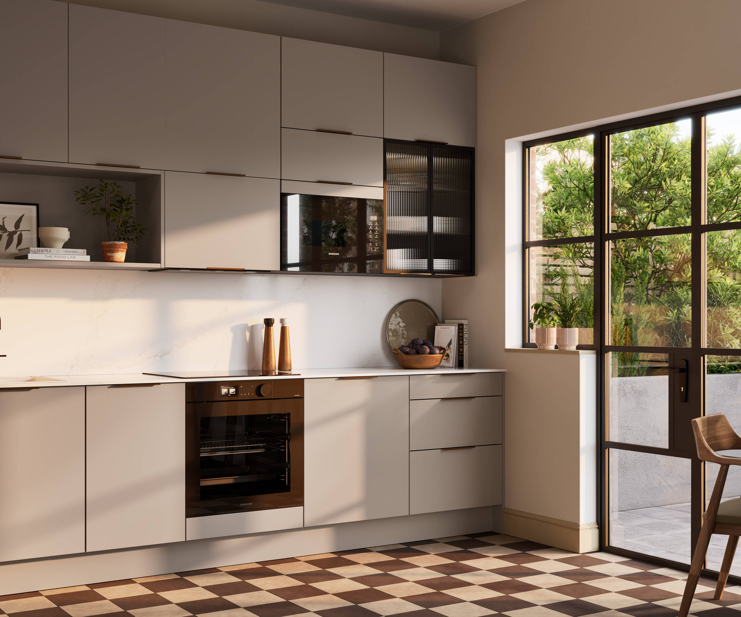 Angled view of modern slab front Soho Cornish Clay kitchen from Magnet in Pantone’s colour of the year ‘Mocha Mousse’ with bronze trim handles, handles, silestone quartz worktop and matching backsplash, checkered flooring.