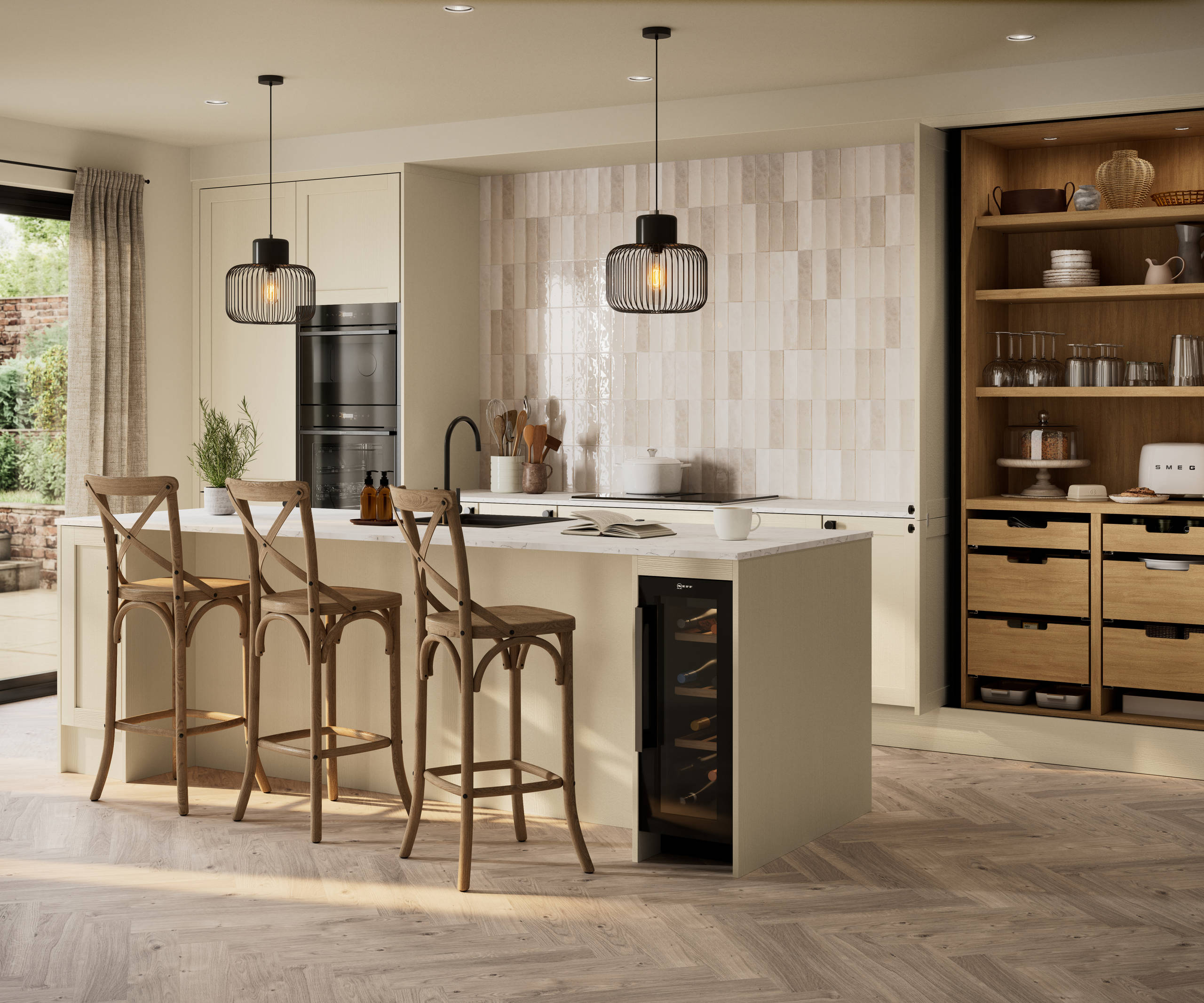 Contemporary Shaker kitchen Ambleside from Magnet in neutral shade Sand with black sink and tap in kitchen island, induction hob with extractor and tall cabinet pocket door larder, wine cooler in kitchen island.