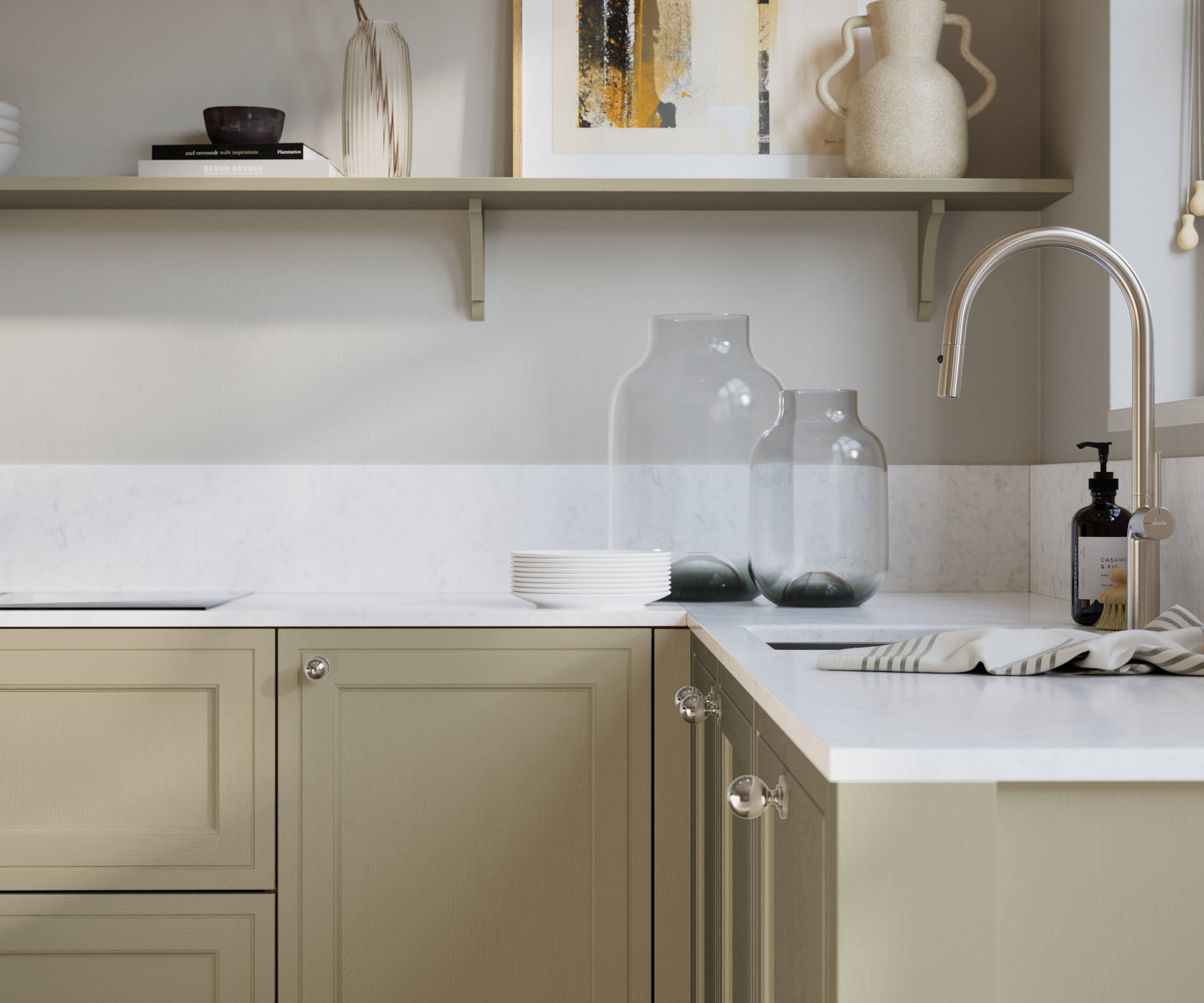 Bewdley Parchment painted wood grain Shaker kitchen cabinetry with steel knobs, steel tap, white marbled worktop and matching backsplash, an open shelf on the wall above cabinets with ceramics and a vase of flowers.