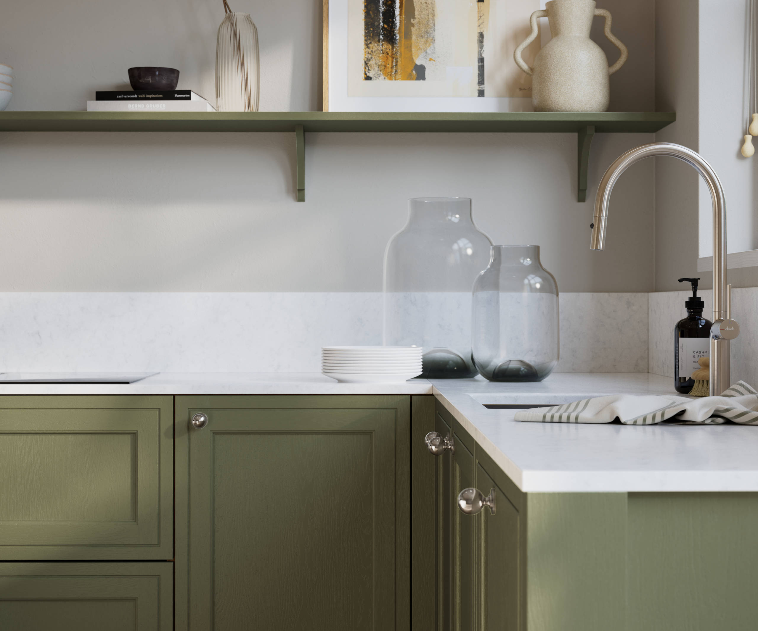Bewdley Misty Moors painted wood grain Shaker kitchen cabinetry with steel knobs, steel tap, white marbled worktop and matching backsplash, an open shelf on the wall above cabinets with ceramics and a vase of flowers.