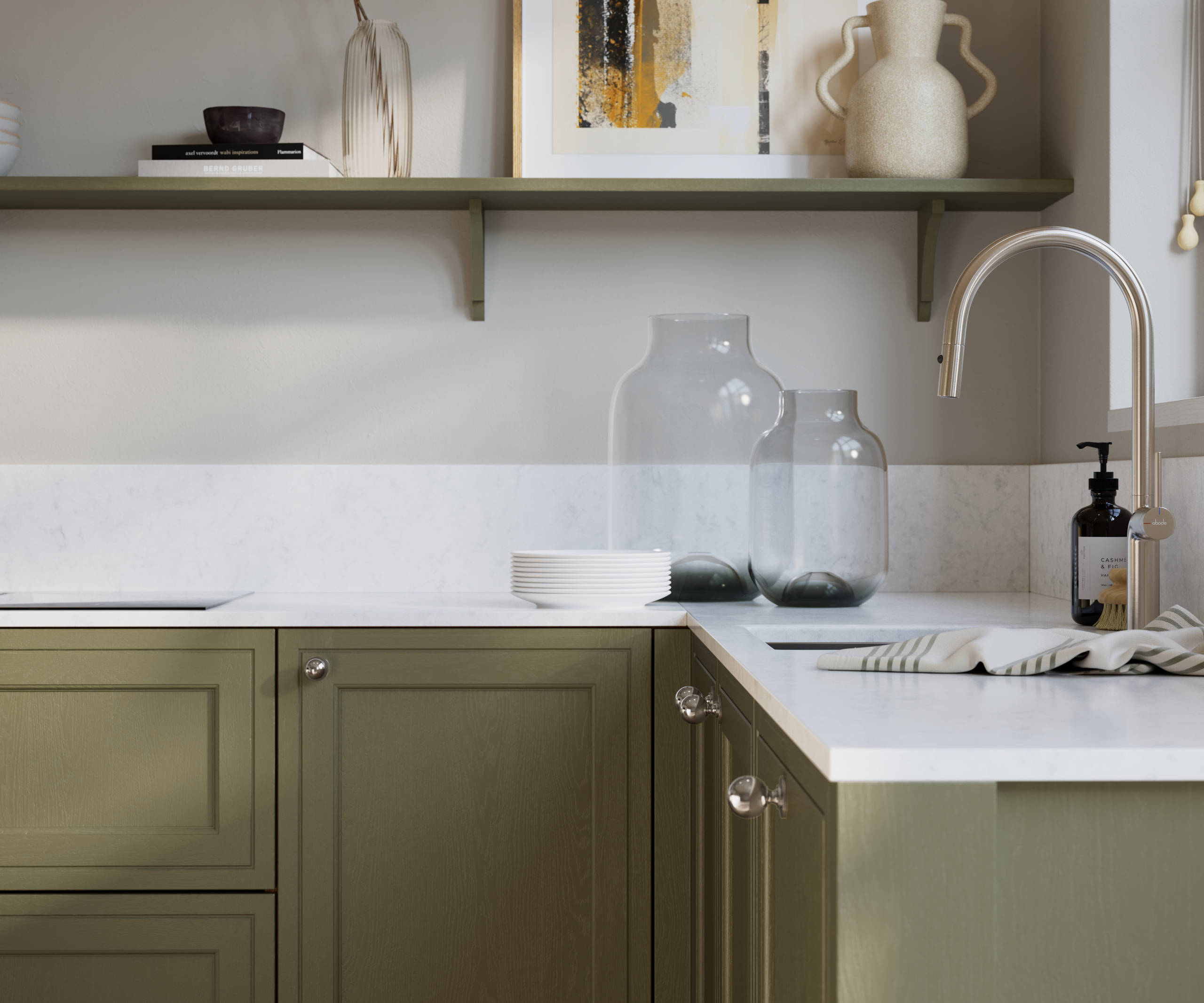 Bewdley Balmoral painted wood grain Shaker kitchen cabinetry with steel knobs, steel tap, white marbled worktop and matching backsplash, an open shelf on the wall above cabinets with ceramics and a vase of flowers.