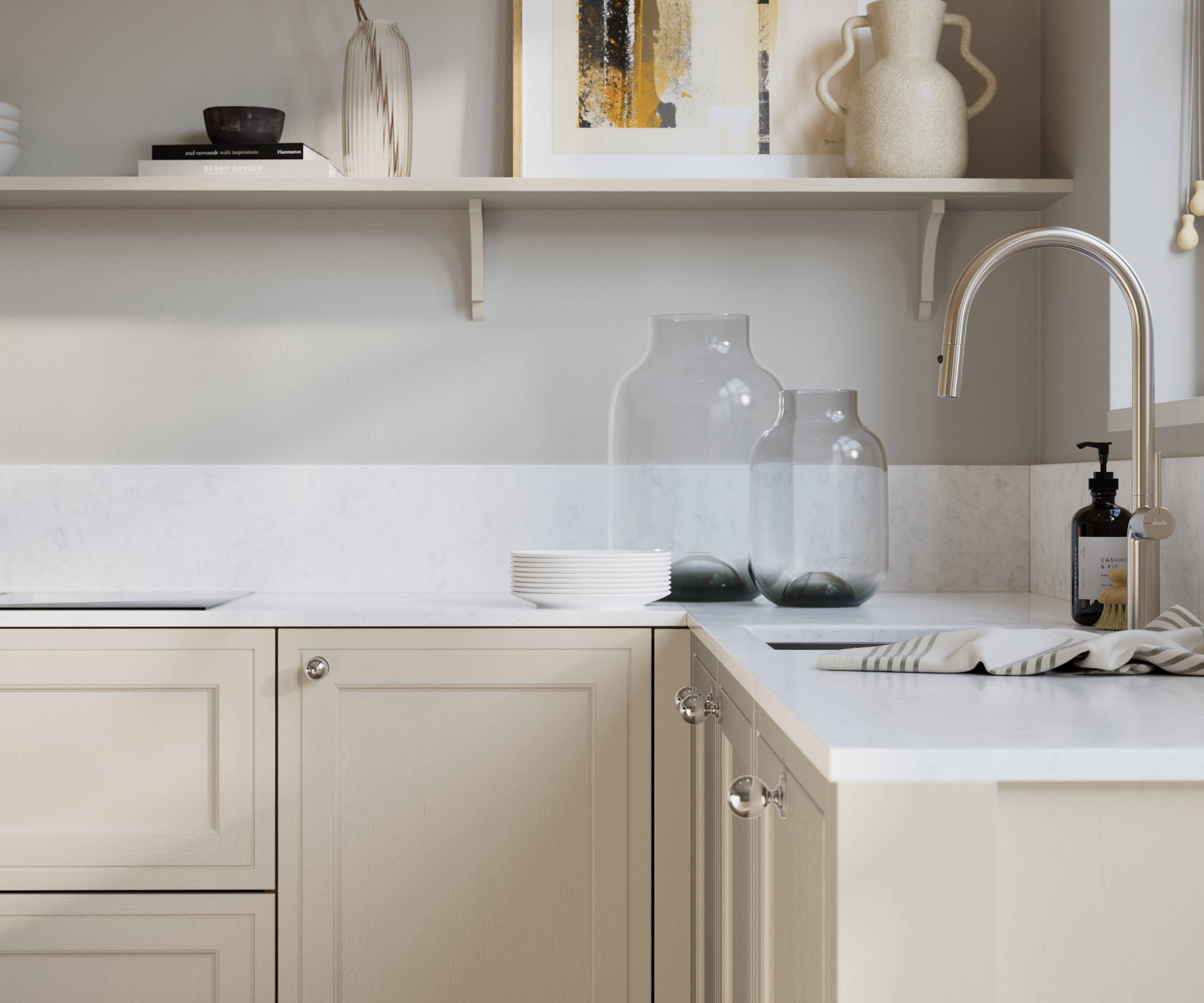 Bewdley Limestone painted wood grain Shaker kitchen cabinetry with steel knobs, steel tap, white marbled worktop and matching backsplash, an open shelf on the wall above cabinets with ceramics and a vase of flowers.