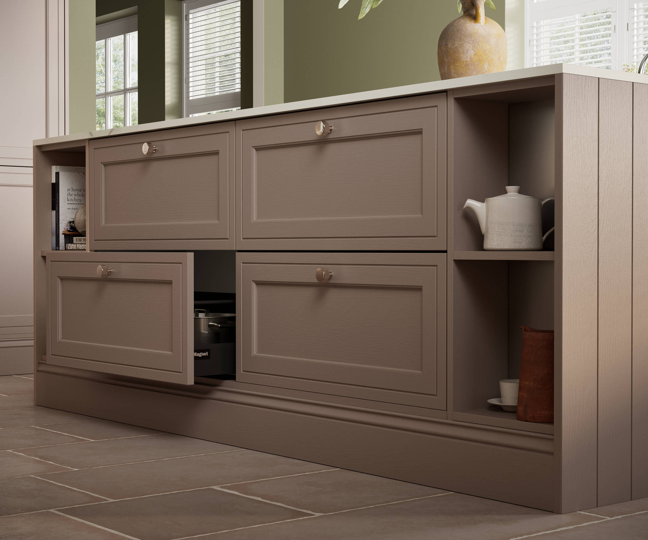 Close-up view of Shaker style painted wood grain Bewdley cabinet kitchen island with classic design steel knobs, open shelves and decorative splinth matching the Cornish Clay shade.