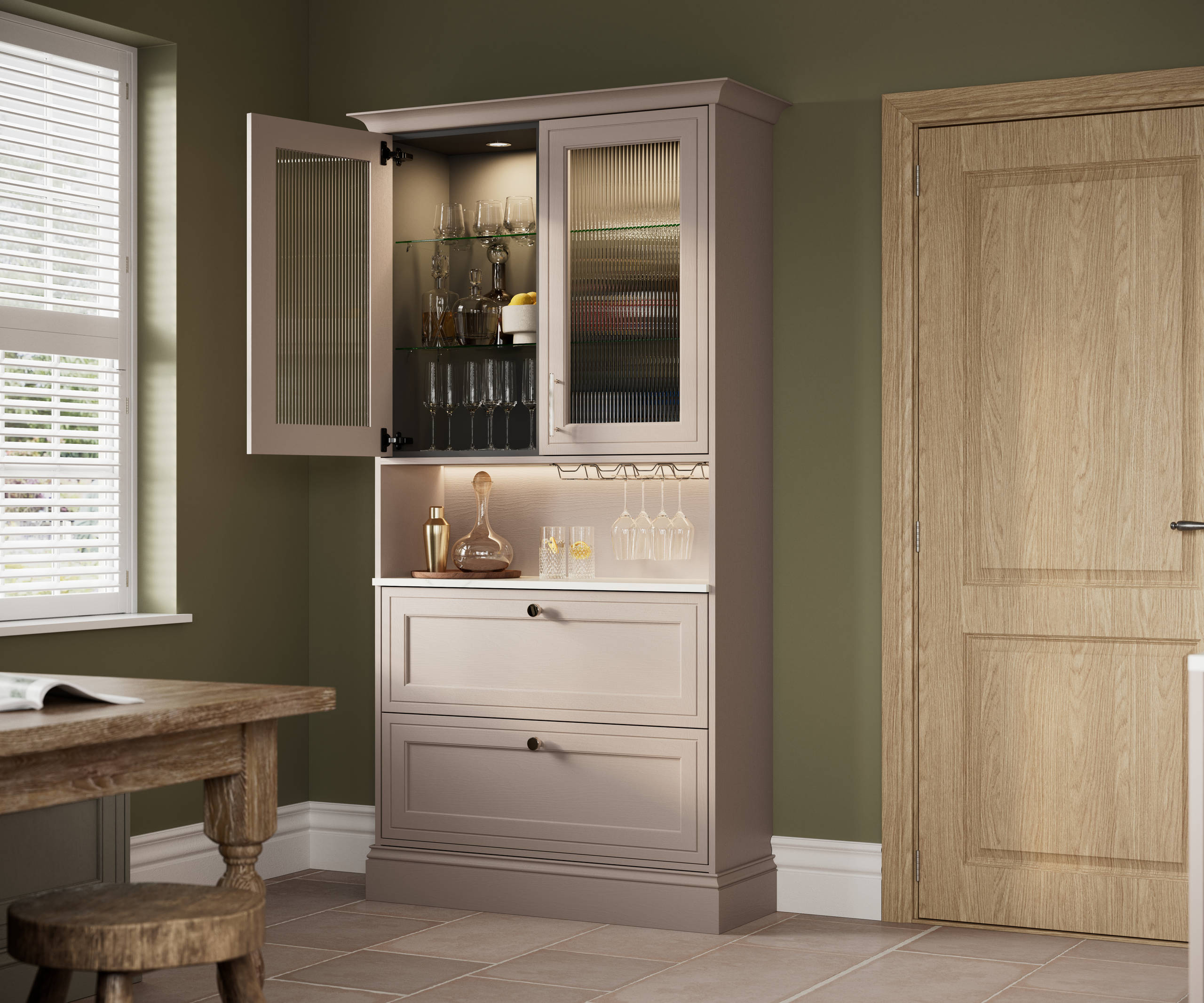 View from dining area of Shaker style painted wood grain dresser cabinets Bewdley Cornish Clay, ribbed glass vitrine with built-in lighting.