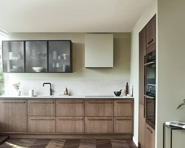 Nordic Nature. Modern wooden kitchen design with a Nordic influence. Featured floating worktops, a ribbed plinth and rounded end panels