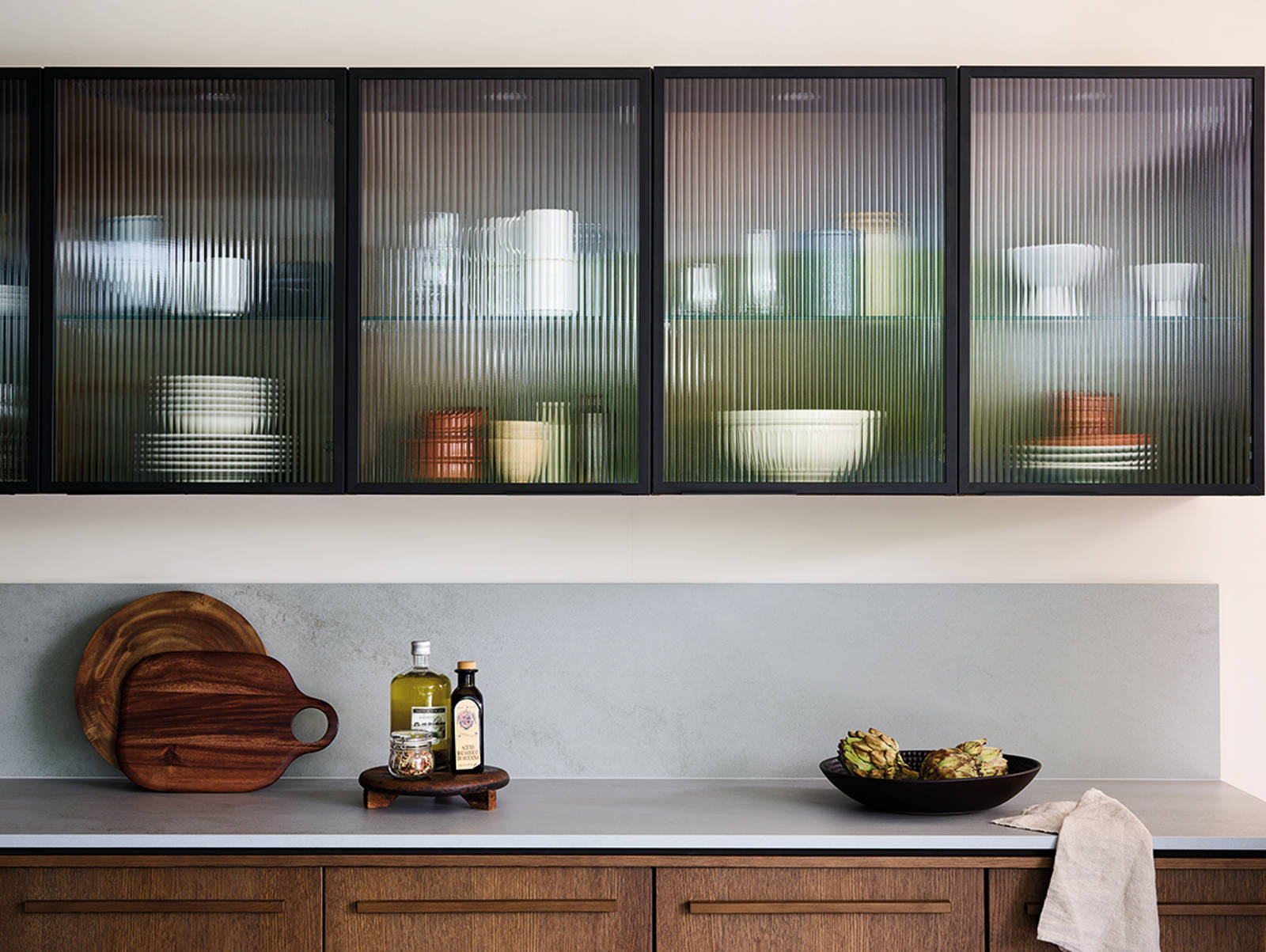 Nordic Nature. Modern wooden kitchen design with a Nordic influence. Featured floating worktops, a ribbed plinth and rounded end panels.