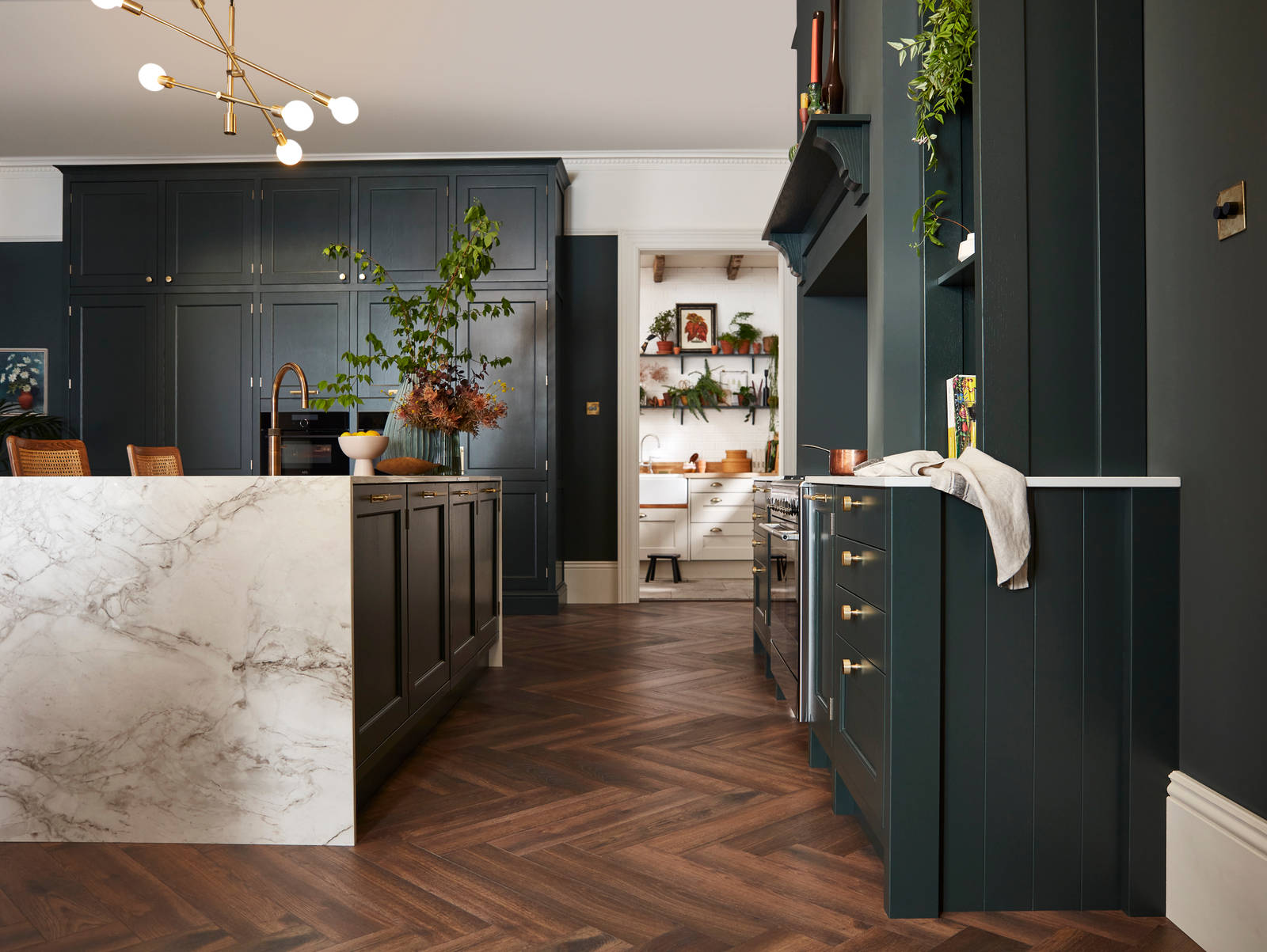 Ludlow, a traditional Shaker-style kitchen range featuring panelled doors with visible woodgrain and beading detail, in the shade Arboretum Green.