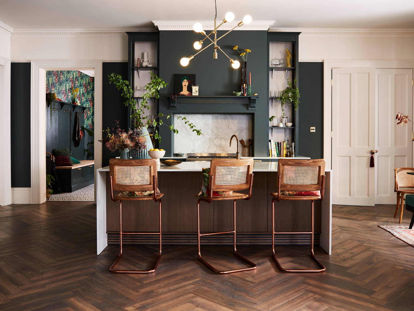 Ludlow Arboretum kitchen with brass and wood barastools in an open plan layout
