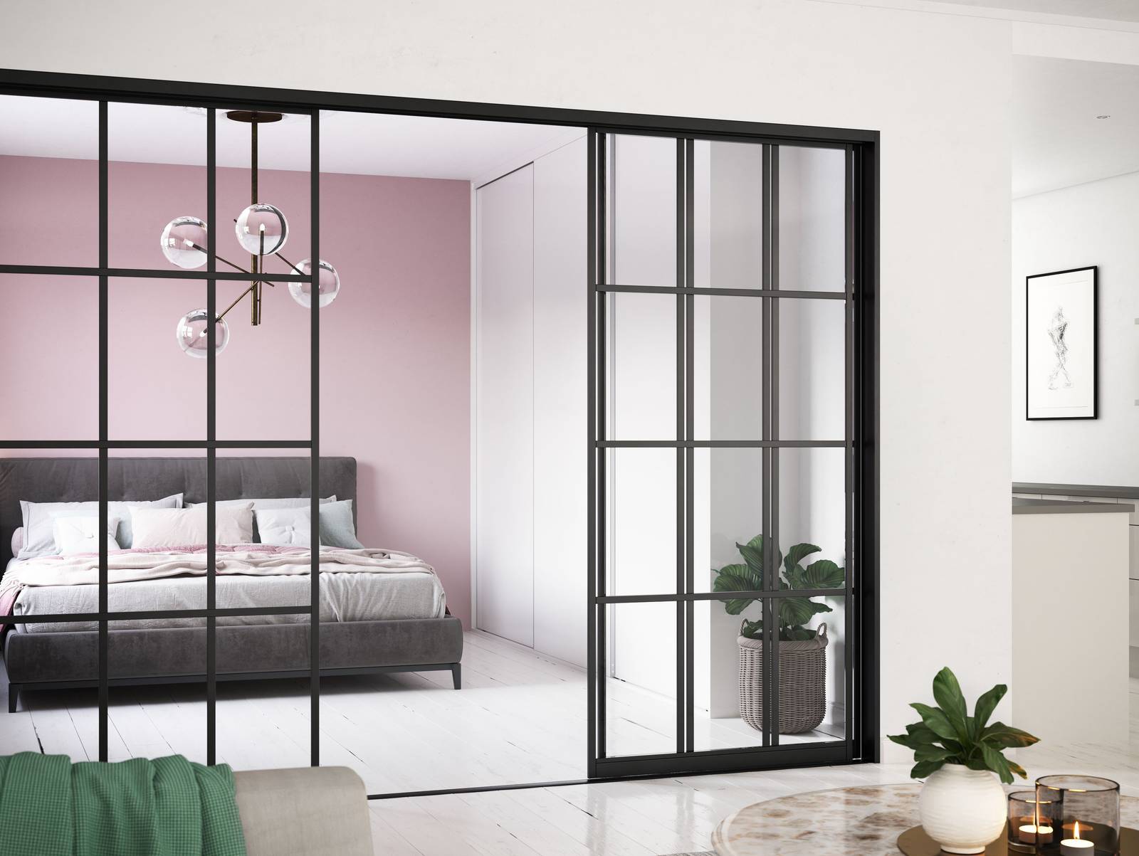 Glasskydedør med sort metalramme mellem stue og soveværelse
